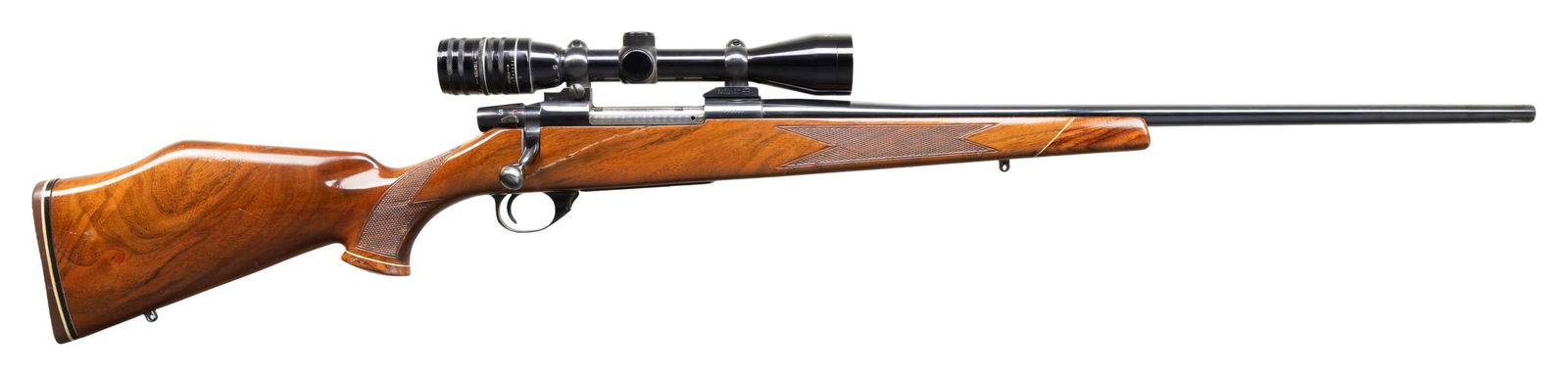 25-06, WEATHERBY VANGUARD BOLT ACTION RIFLE WITH: SCOPE. Cal. 25-06. S# V15560. This Series 1 rifle with 24" sporter bbl. has caliber marking at rear. Blued action marked "VANGUARD" and "MADE IN JAPAN" on left side wall. Engine turned bolt with dual