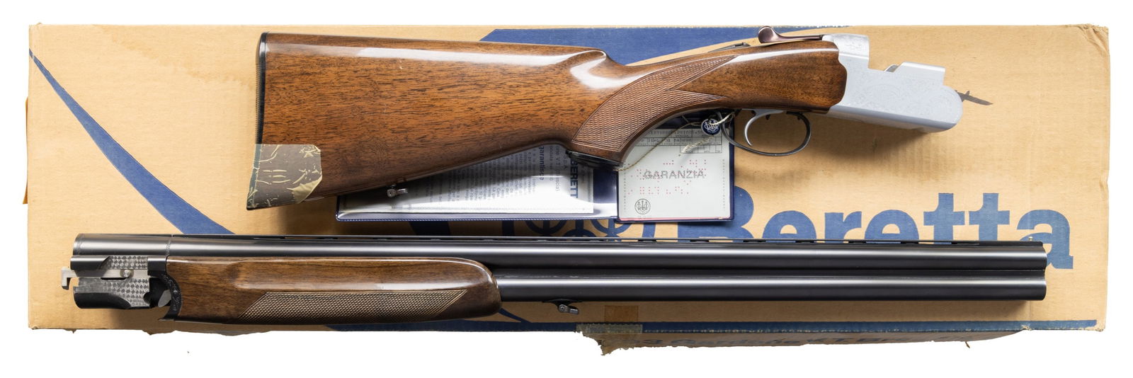 BERETTA S.56E O/U SHOTGUN WITH FACTORY BOX.: Cal. 12 Ga, 2 3/4". S# B12916B (AA = 1975). VR 28" barrels w/ steel bead; Full & IM measured fixed chokes. Silver finish engraved action w/ SST & ejectors. Checkered walnut stock set w/ black Beretta