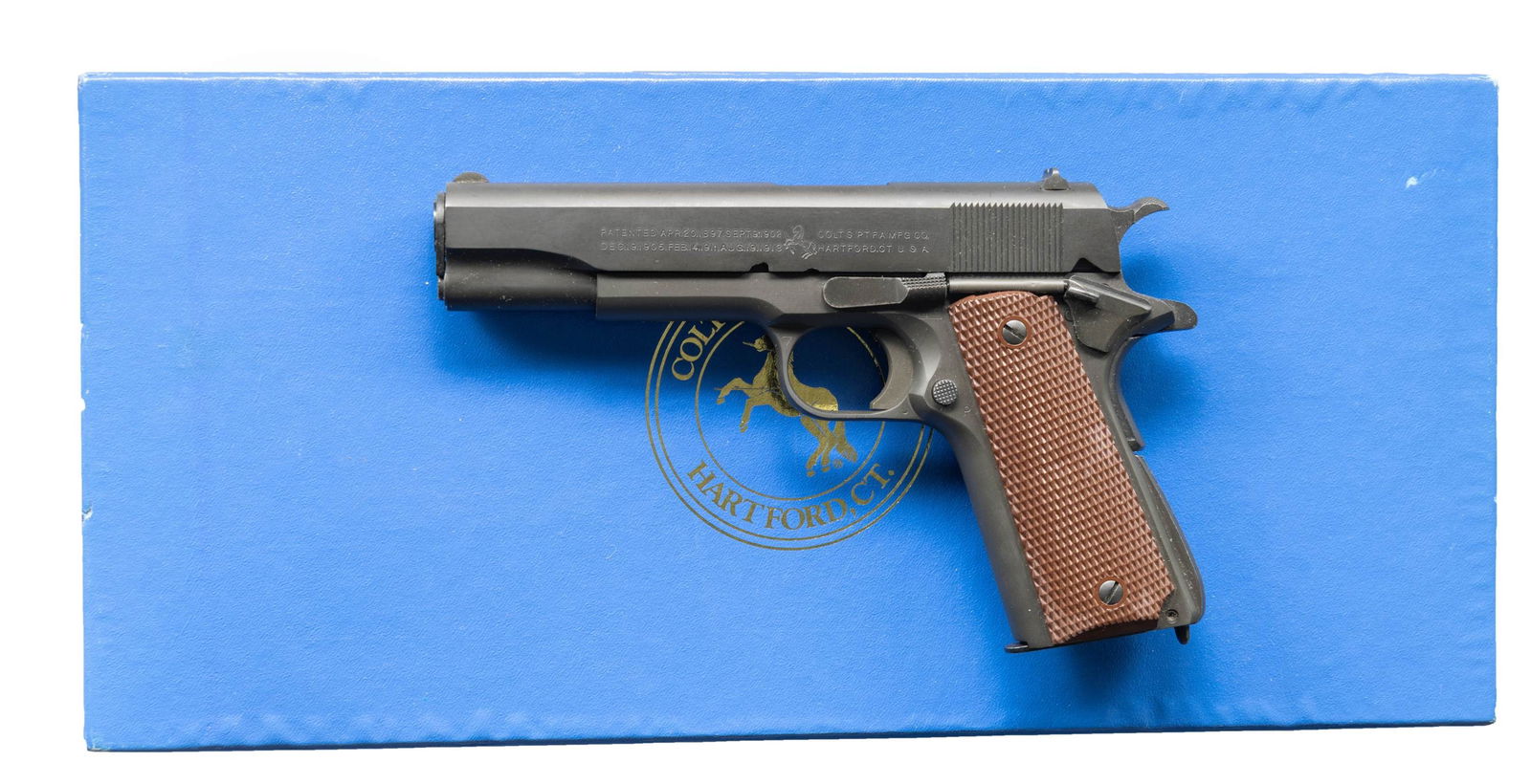 COLT CUSTOM SHOP M1911A1 WWII REPLICA MODEL O: SEMI AUTO PISTOL WITH COLT BOX. CAL. 45 ACP. S# WK01051 (2001). One of approx. 4,000 mfg. 2001-2004 as a replica of World War II era Colt M1911A1 with parkerized finish & brown composite grips. MAGS: