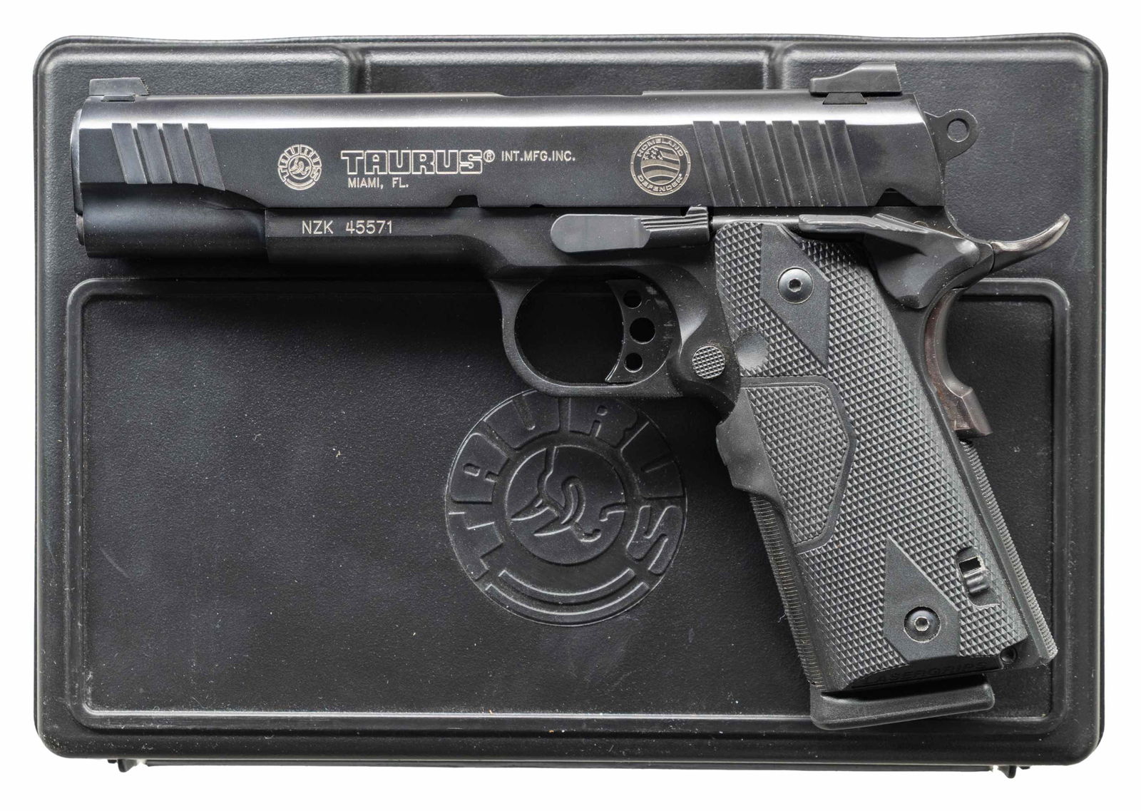 TAURUS HOMELAND DEFENDER PT1911 SEMI AUTO PISTOL.: Cal. 45 ACP. S# NZK45571. Bbl. 5". Heine two dot sights. Homeland Defender marked slide with front & rear serrations. Ambi safety. Extended beavertail grip safety. Stippled grip straps. Red laser
