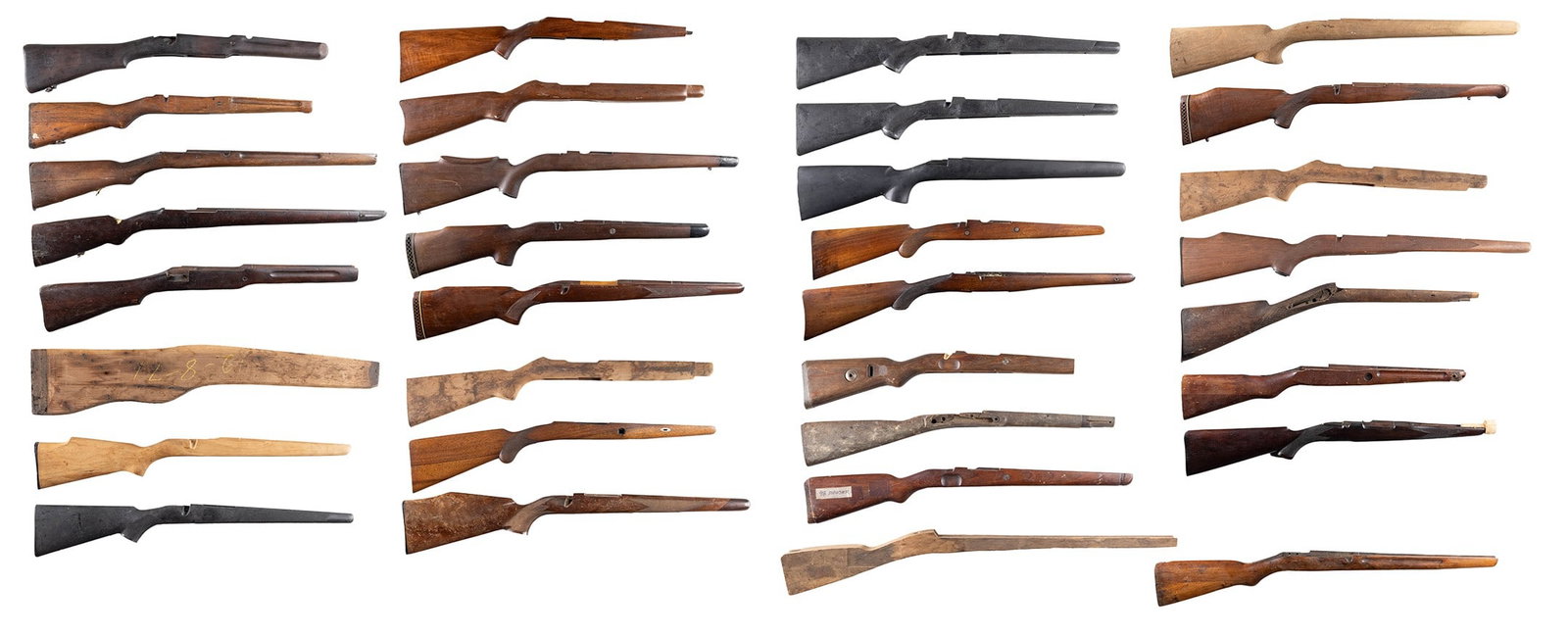 GROUPING OF 32 SPORTING RIFLE STOCKS.: Notable sporter stocks include, but are not limited to, early walnut Ruger 10-22, Winchester Model 70, two early Mannlicher sporting stocks, three early Mauser sporting stocks and three synthetic stoc