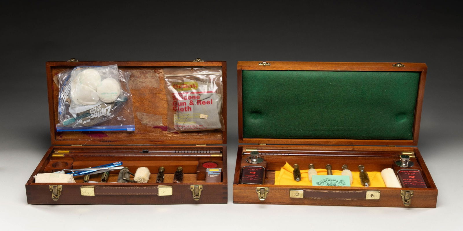 2 ABERCROMBIE & FITCH CLEANING KITS.: 1) 1- British made attractive kit in walnut box with A&F marking on top contains 2 piece wood and brass cleaning rod with brushes, mops and jag, along with cans of Rangoon oil and Nevarust oil and 2 r