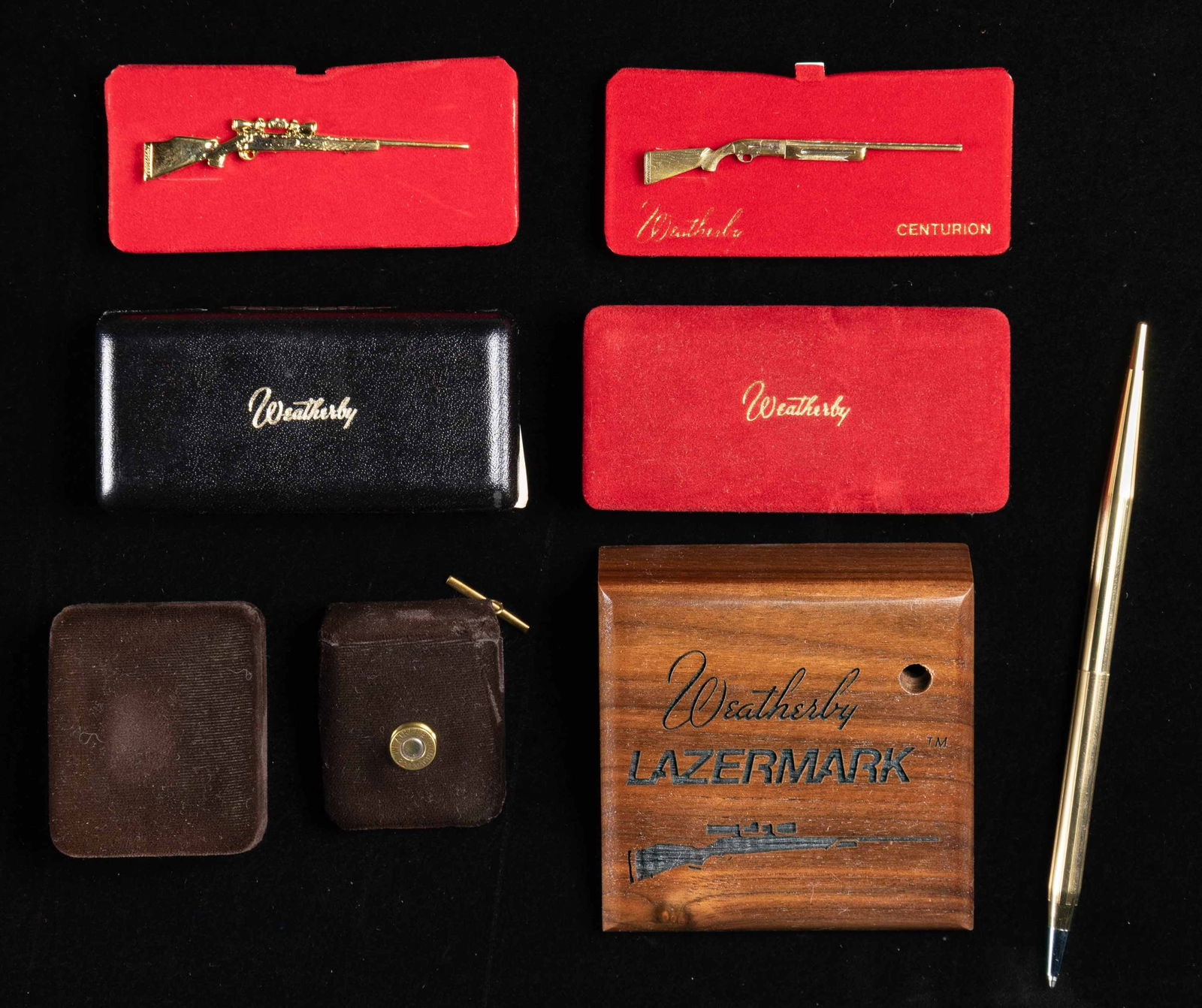 LOT OF 4 PIECES OF WEATHERBY MEMORABILIA.: Lot of 4 pieces of Weatherby memorabilia, including: 1) Gold colored pen mfg. by The Quill Co. Interior of pen is marked "THE QUILL CO. PROVIDENCE, R.I./ DURATONE 95 MEDIUM K4/ MADE IN U.S.A." Pen is