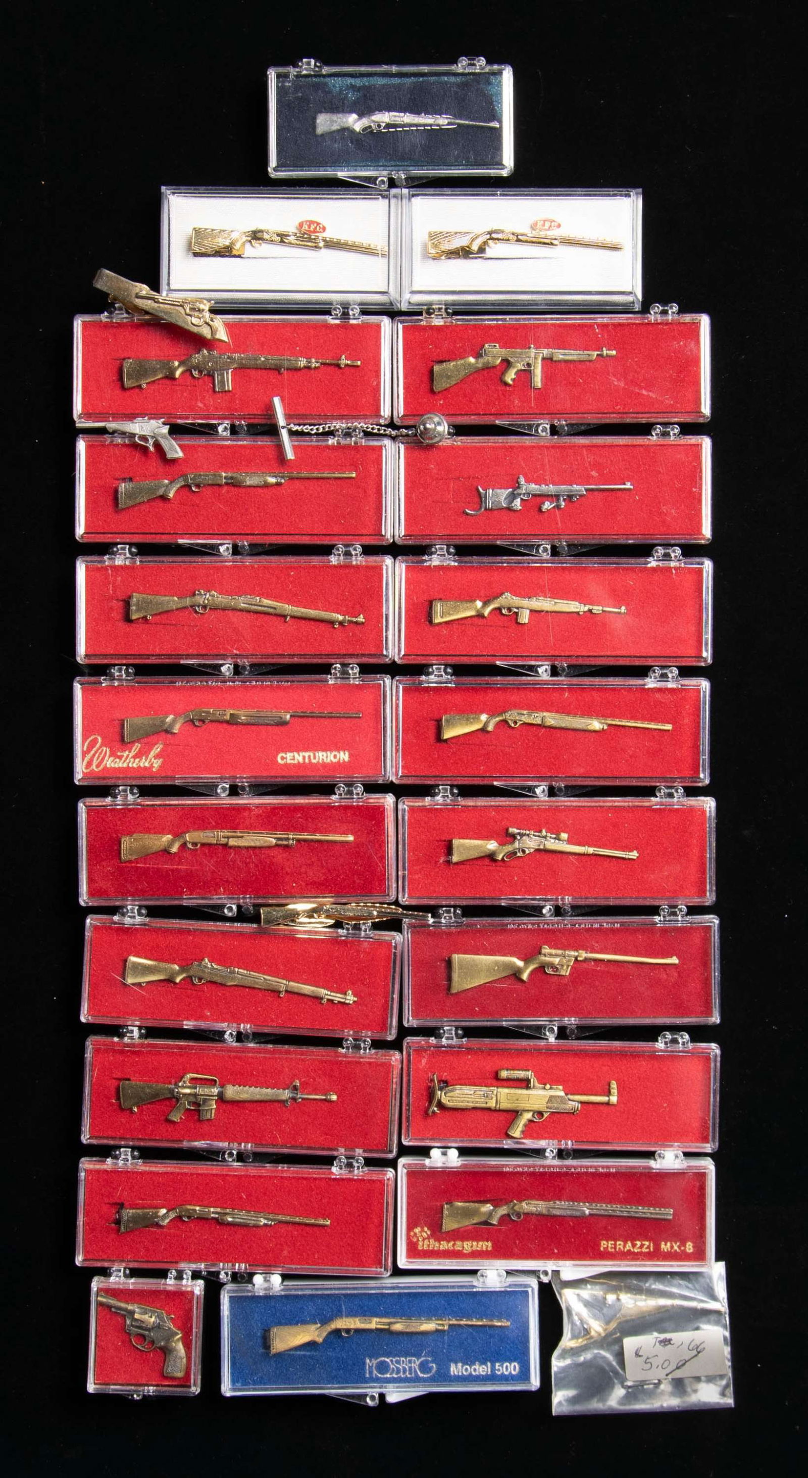 LOT OF ASSORTED FIREARMS RELATED TIE CLASPS &: CUFF LINKS. Lot of assorted firearms related tie clasps and cuff links, including: 1) x1 Unmarked brass Springfield 1903 rifle tie clasp. 2) x1 Unmarked brass Thompson submachine gun tie clasp. 3) x1