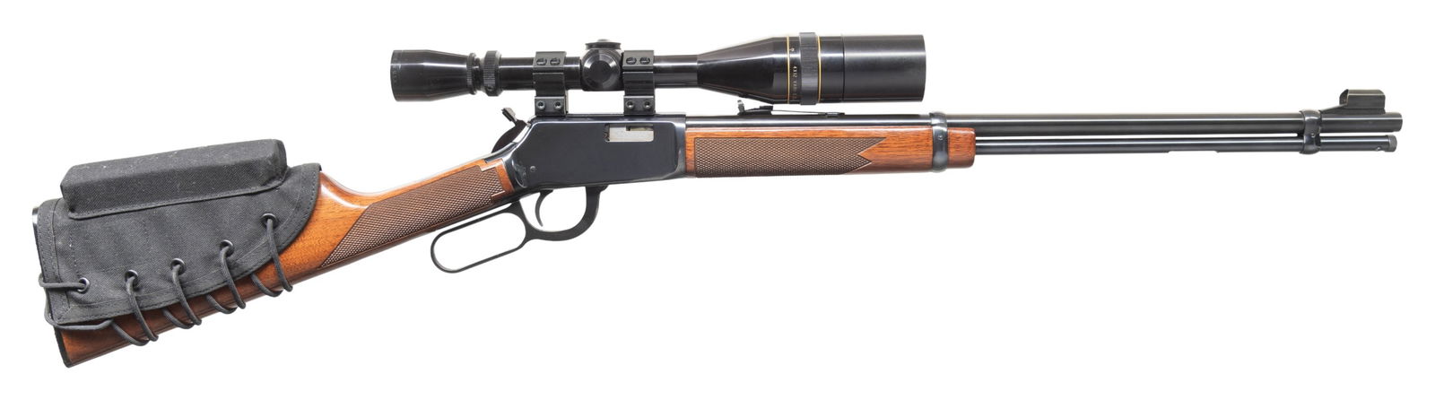 FINE WINCHESTER MODEL 9422M XTR LEVER ACTION RIFLE: WITH LEUPOLD SCOPE. Cal. 22 Win. Mag. S# F448277. Bbl. 20 1/4". Model 9422M XTR lever action rifle mfg. by Winchester. Left side of the bbl. exhibits standard factory markings denoting the model and c