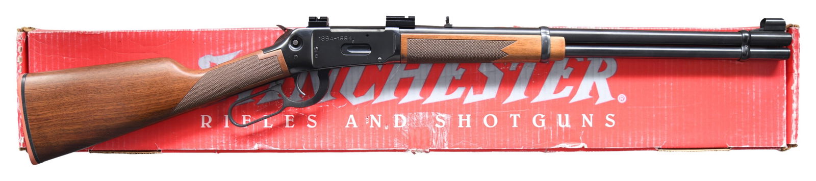 WINCHESTER MODEL 94 AE BIG BORE LEVER ACTION RIFLE: Cal. 356 Win. S# 6145949. Bbl. 20". Hooded bead front sight. Folding rear sight. Receiver mounted Weaver style scope bases. 100th Anniversary 94 with right side of receiver marked "1894-1994". Crossbo