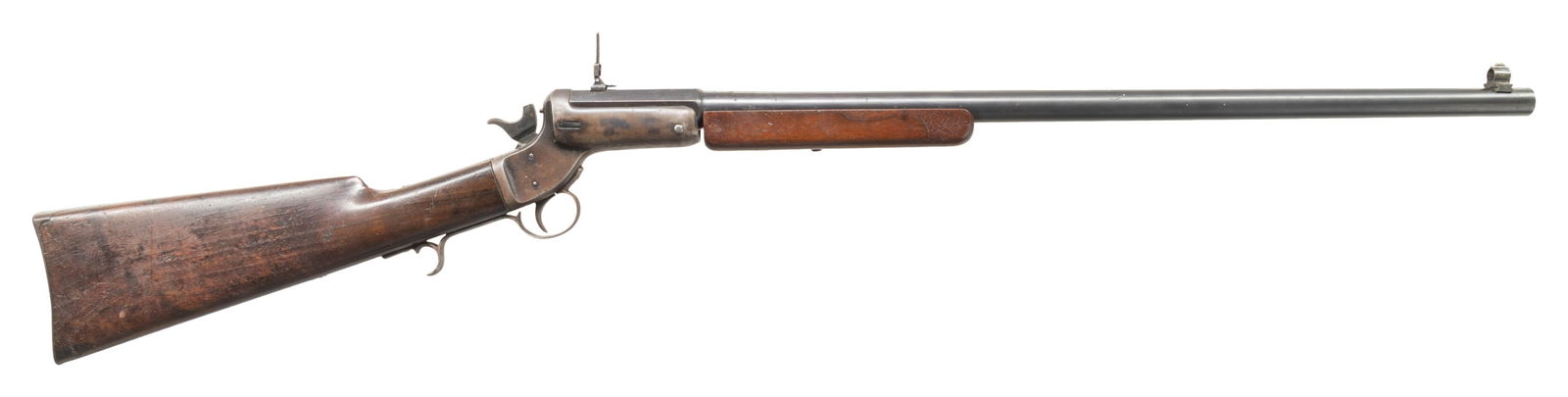 44 LONG CF J. STEVENS TIP-UP RIFLE.: Cal. 44 Long CF. S# 4879. Bbl. 26" w/ walnut forearm. Combination globe front sight & ladder rear sight. Tip-up action w/ mushroom button opening & finger curl triggerguard. Walnut buttstock w/