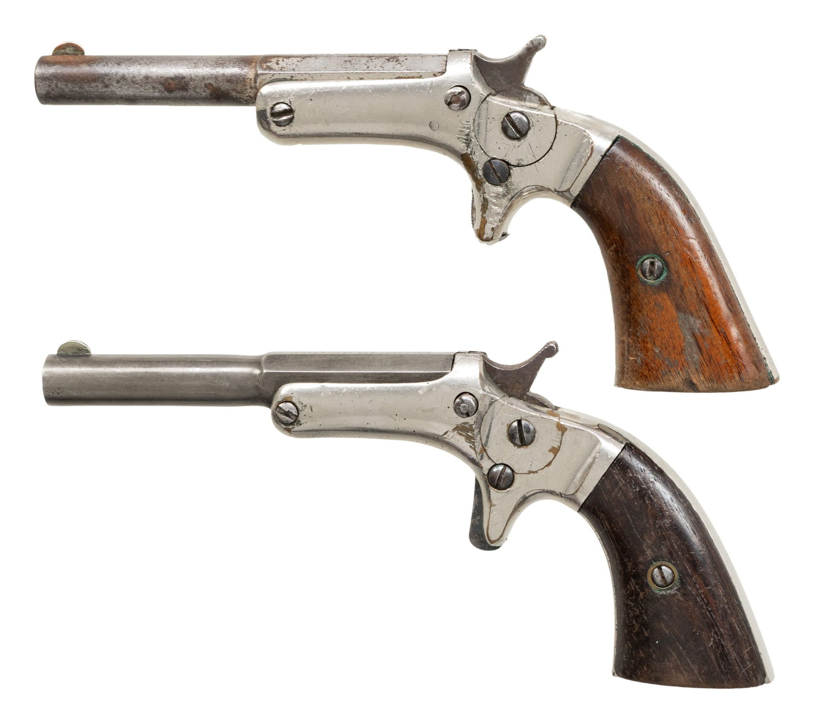 2 J. STEVENS OLD MODEL POCKET PISTOLS.: ALL: cal. 22 Short. Bbls. 3.5". Blade front sights. Nickel finished brass frames. Hammer has firing pin. 1) S# 5310. Walnut grips. CONDITION: bbl has fair traces of nickel with pitting. Good nickel