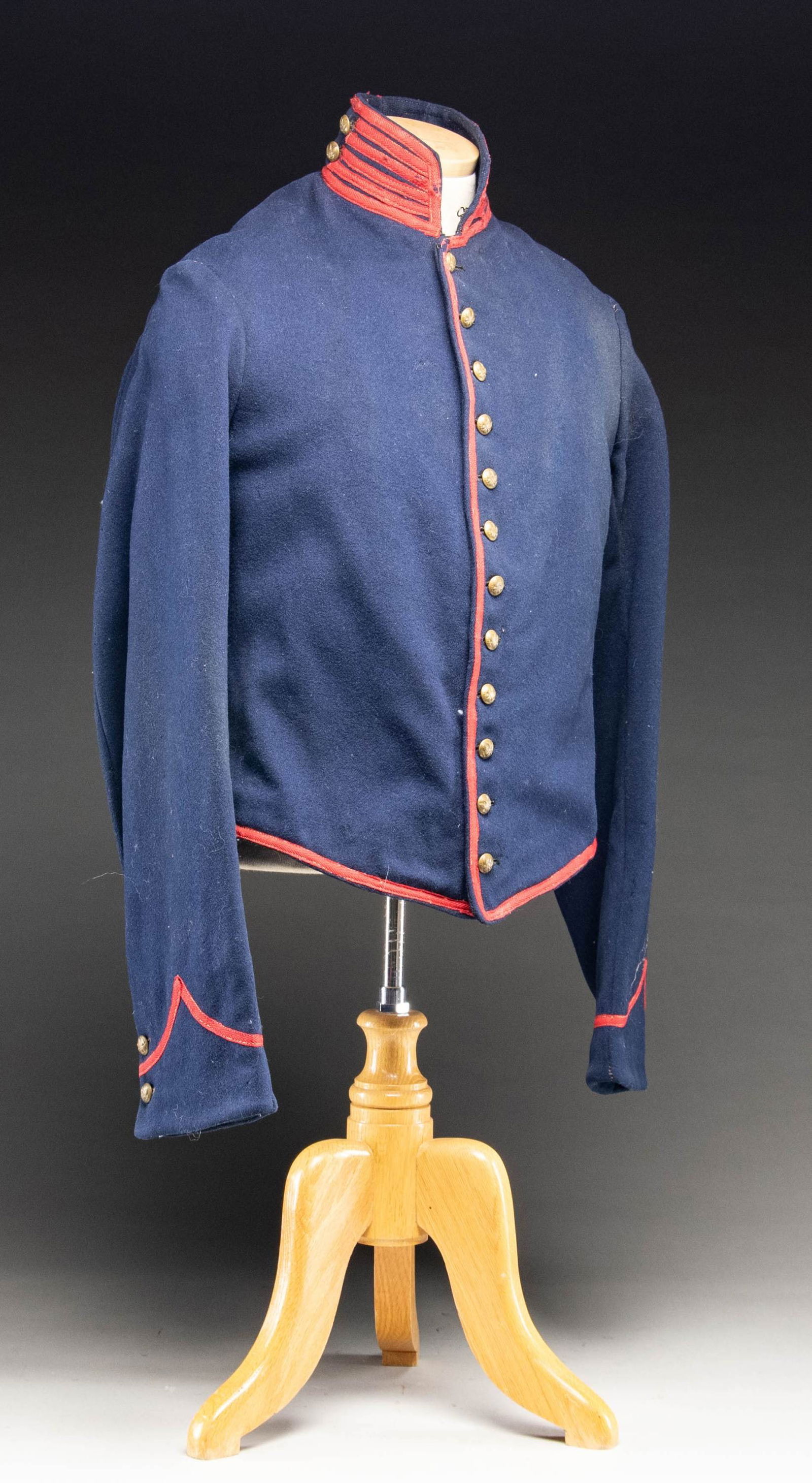 CIVIL WAR ARTILLERY SHELL JACKET.: Cincinnati Arsenal fabricated example, "US" inspectors mark, size "2", complete lining, interior pocket, stenciled in back by costume company size 38 and inventory number. CONDITION: very good