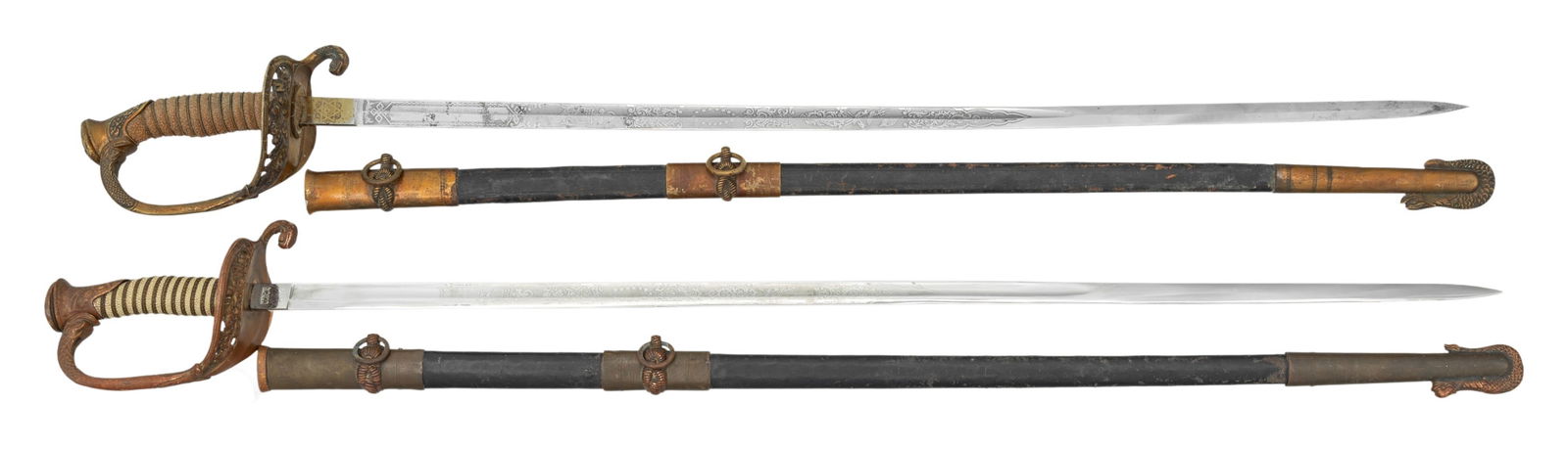 2 POST CIVIL WAR US NAVY M1852 OFFICER'S SWORDS.: 1) A post Civil War M1852 US Navy officer's sword measuring 37" overall featuring a blade etched with various nautical, patriotic and foliate motifs and the name "J. M. PETERSON". There is no makers