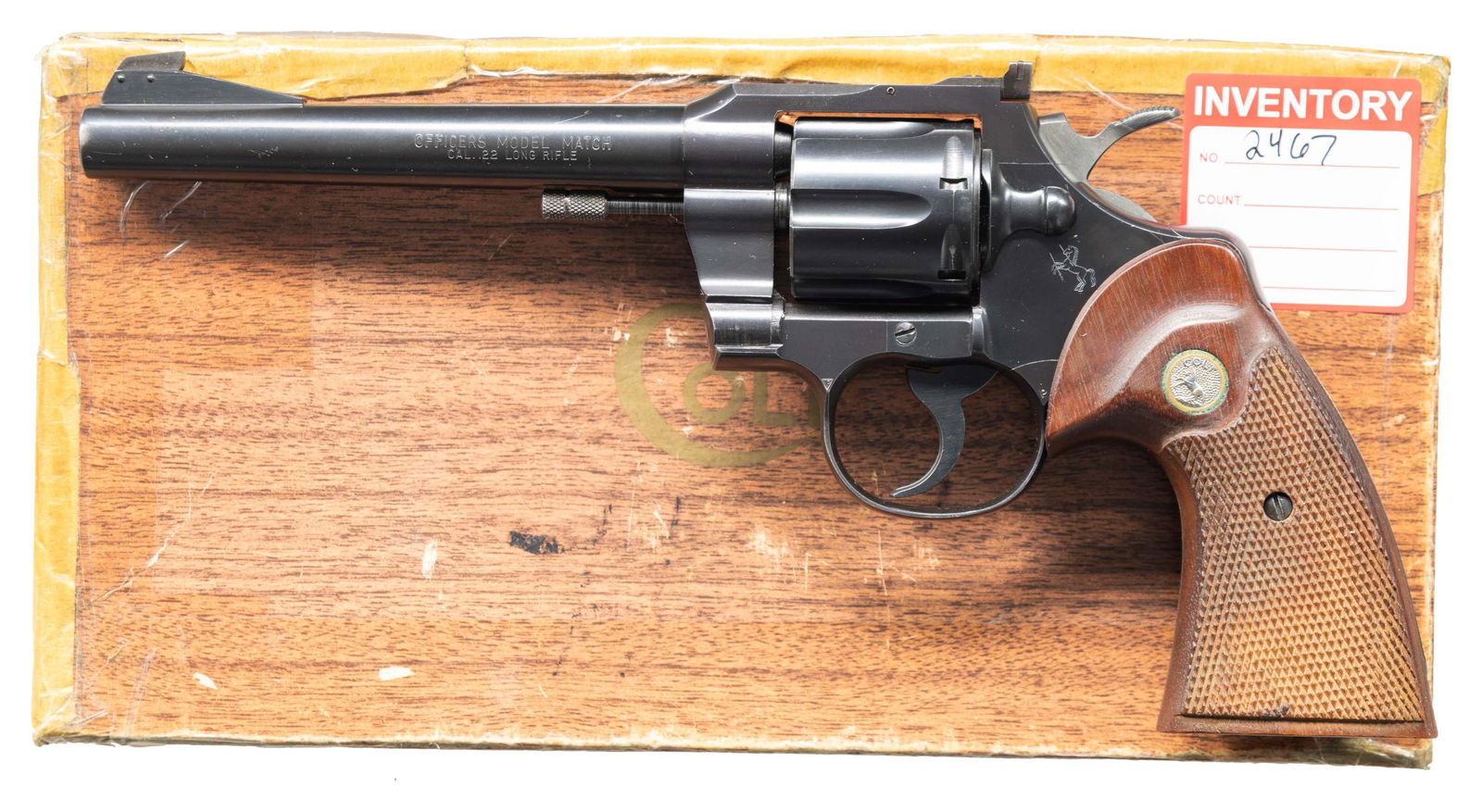 COLT OFFICERS MODEL MATCH .22 LR DOUBLE ACTION: REVOLVER WITH FACTORY BOX. Cal. 22 LR. S# 80705. Bbl. 6". Officers Model Match double action revolver mfg. by Colt in 1961. Left side of the bbl. is marked "OFFICERS MODEL MATCH/ CAL. .22 LONG RIFLE",