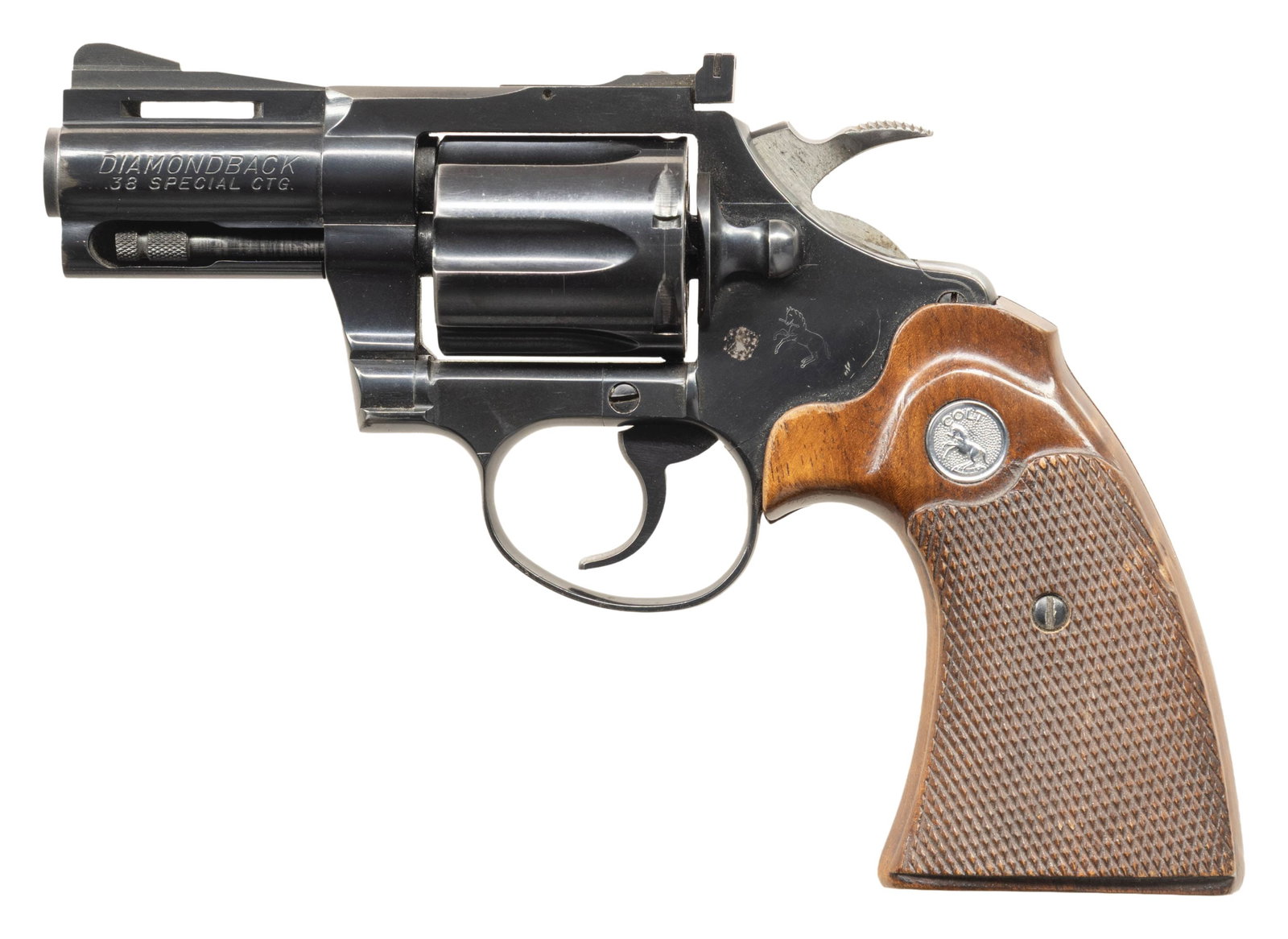 COLT DIAMONDBACK 2 1/2" BARREL 38 SPL. REVOLVER.: Cal. 38 Spl. S# D51459. Mfg. approx. 1972. Bbl. 2 1/2". Serrated blade front sight with added red paint; adj. rear sight. 6 Shot fluted cyl. Two piece checkered walnut grips with silver Colt medallion