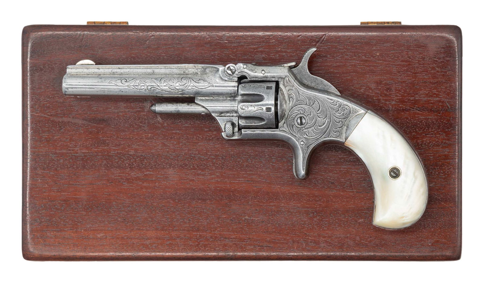 ENGRAVED SMITH & WESSON NO.1 SA REVOLVER.: Cal. 22 S. S# 70696. Bbl. 3 3/16". Round blade front sight. 3rd issue No. 1 Revolver. Nickel finish with case colored hammer & trigger. Metal has what appears to be period floral engraving with about