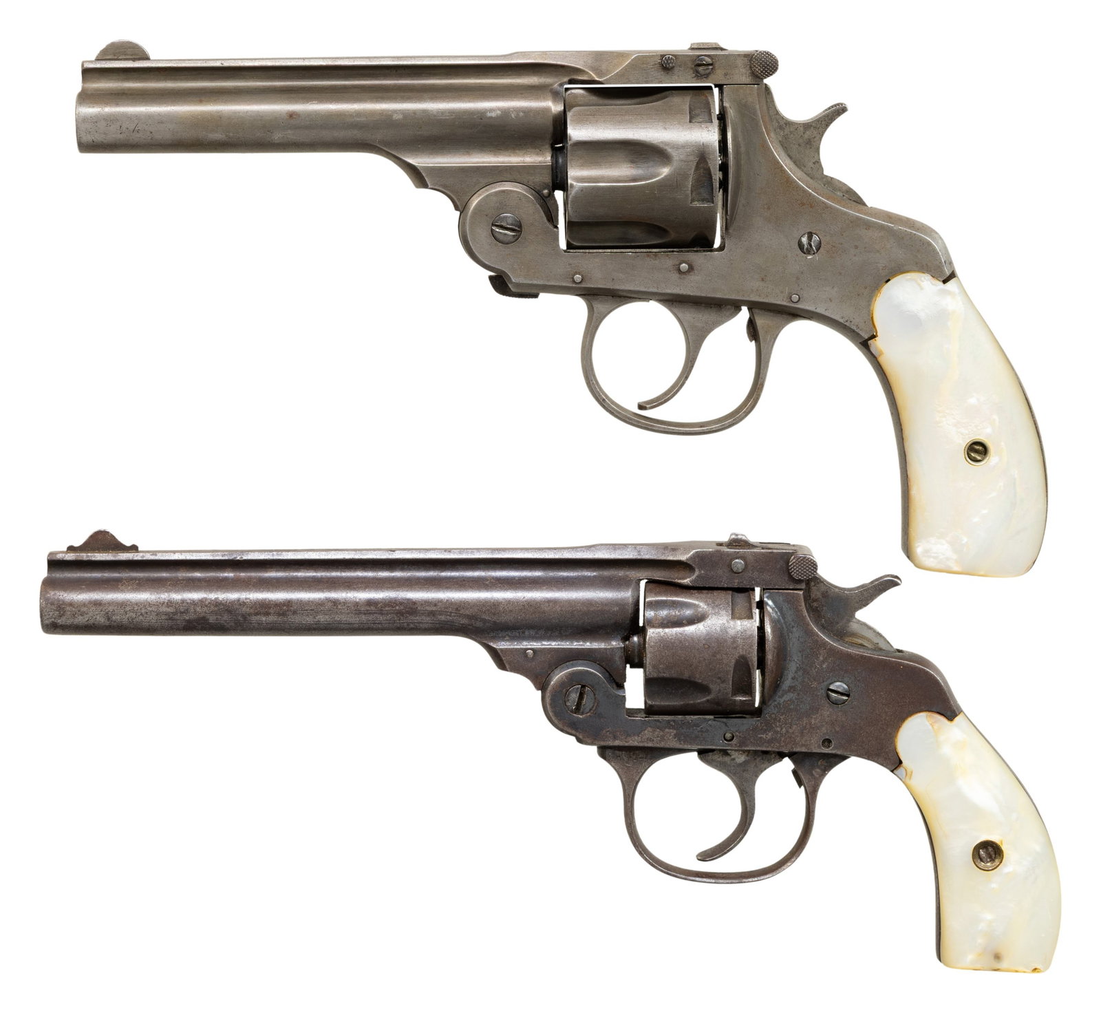 LOT OF TWO 32 DA TOP BREAK REVOLVERS.: Both Cal. 32 S&W.1) H&R 32 DA Top Break Revolver. S# 3161 (Under grip). Bbl. 4". Round blade front sight. Fixed rear sight. 6-shot cyl. Pearl style grips. CONDITION: grips show a few light chips,