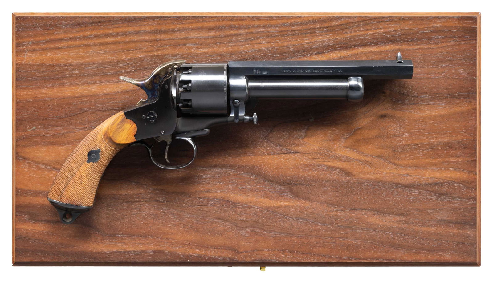 NAVY ARMS LEMAT REVOLVER.: Cal. 44/20 Ga. S# 1083. Bbls. 6 3/4" pistol & 5" shotgun. Blade front sight. Italian made repro of the famous Confederate revolver. Pistol bbl. marked "Col. LeMat". Blued finish with case colored hamm