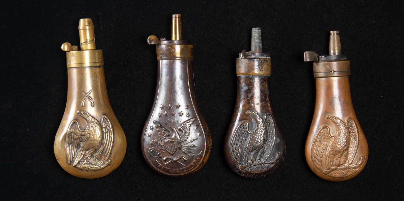 FOUR EAGLE PISTOL FLASKS. - 2