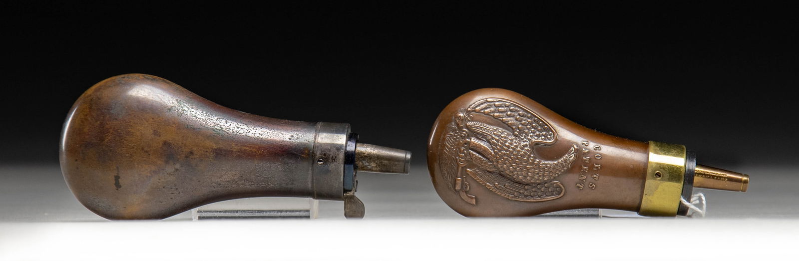 TWO COLT EAGLE PISTOL POWDER FLASKS. - 2