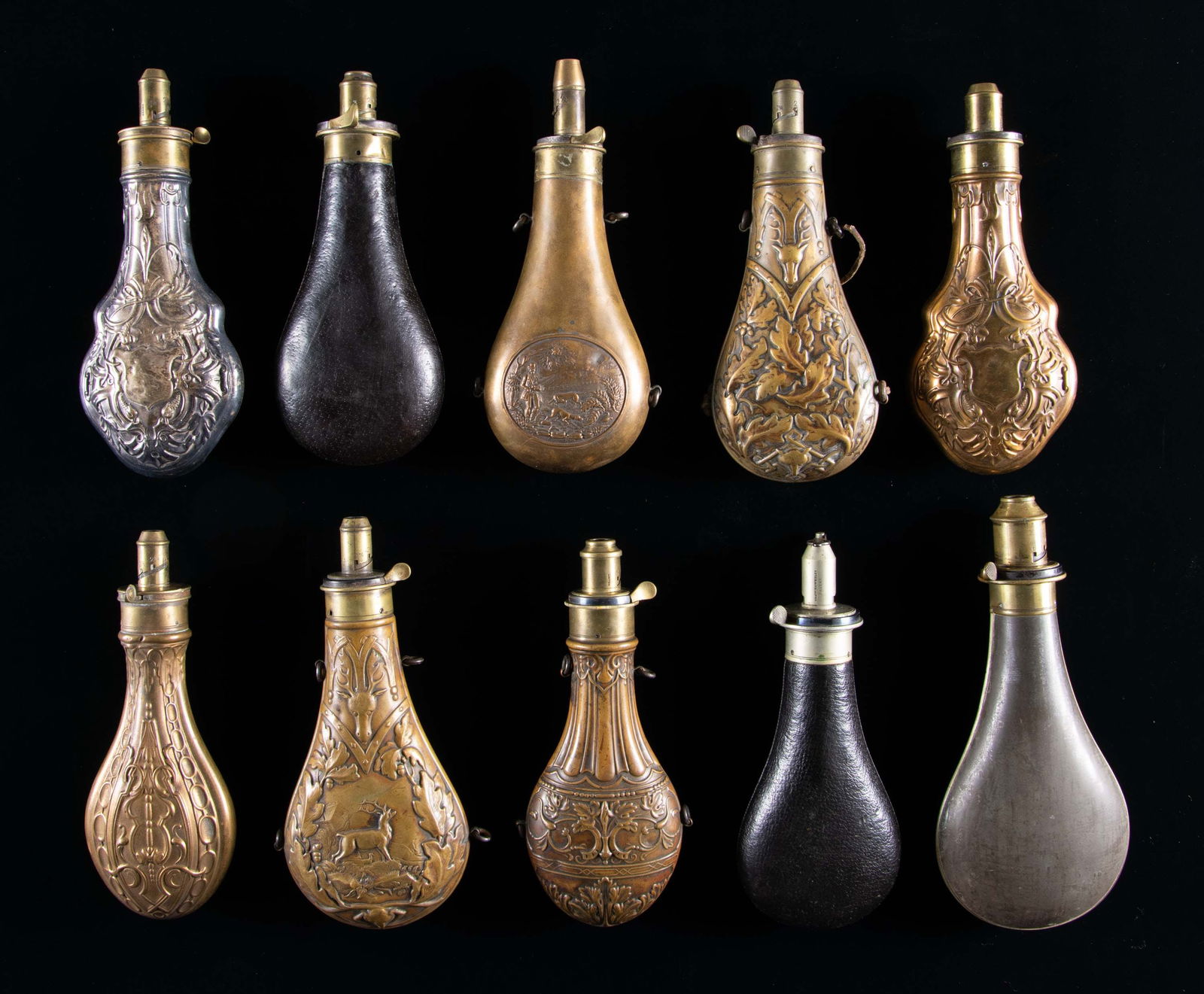 FINE GROUP OF 10 HAWKSLEY RIFLE & SHOTGUN POWDER: FLASKS. Ten variations of Hawksley flasks with different Hawksley, Sheffield markings including 9.5" tin flask with massive 6-dram charger, 8.5" white metal embossed, 8" leather covered with patent ch