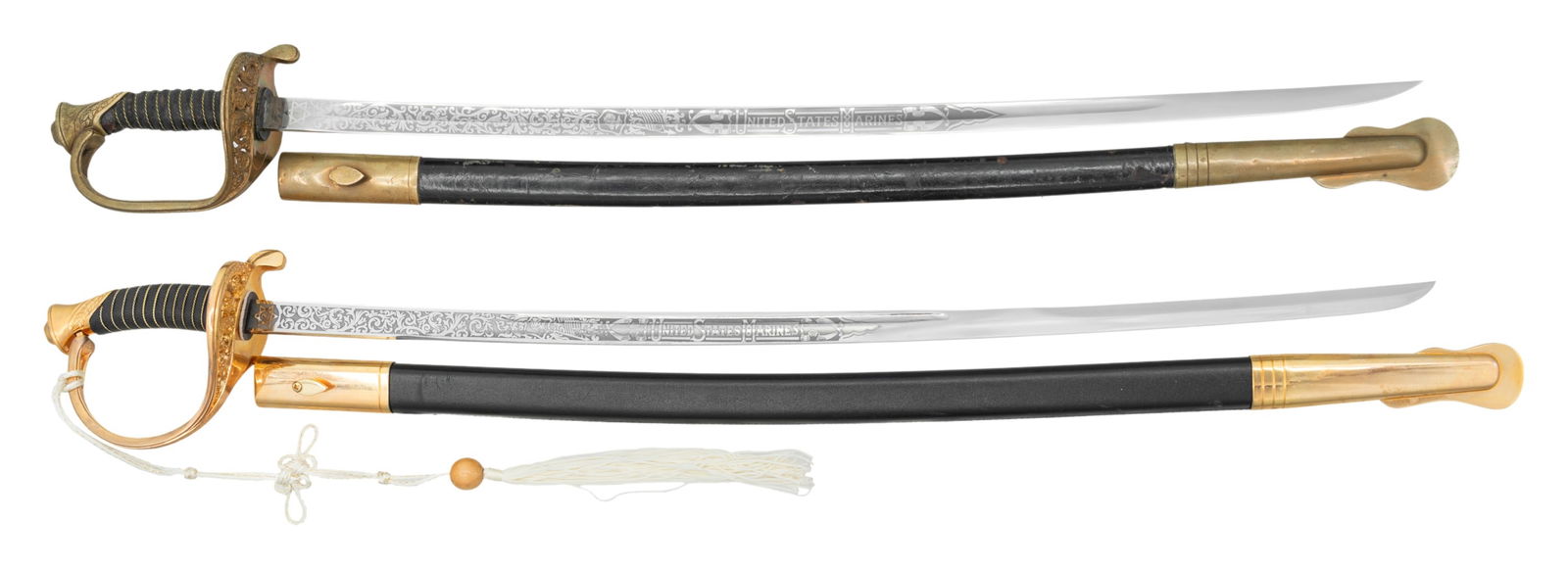 2 UNITED STATES MARINE CORPS NCO SWORDS.: 1) USMC NCO saber from the mid-20th century measuring 34 3/4" overall with an etched blade featuring foliate and Marine Corps motifs along with a panel that reads "UNITED STATES MARINES". The blade is