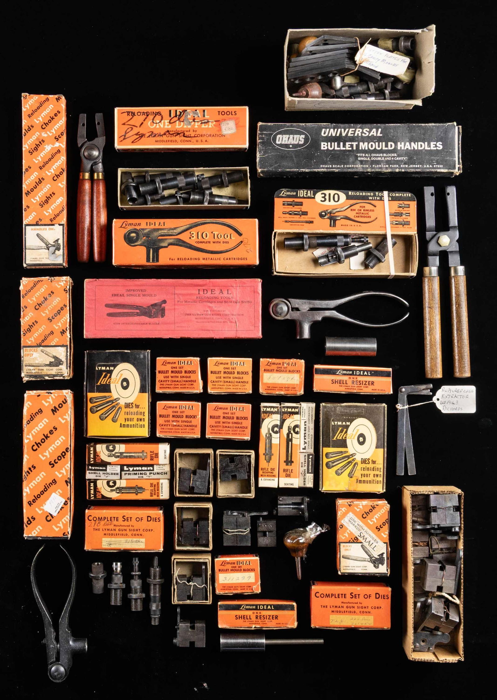 ASSORTED LYMAN RELOADING TOOLS.: 2 Boxed Lyman resizers2 Boxed Lyman mold blocks 5 Boxed Lyman reloading dies.3 Boxed Lyman reloading ties.10+ various cappers 3 tools for hollow base bullet molds.20+ Ideal bullet molds.5+