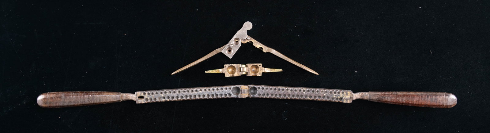 THREE EARLY BULLET MOLDS.: 15" 18th century buck & ball mold, molds 1-69cal ball & 40 shot, complete with wood handles. Brass single 69cal ball missing wood handles, nicely patinaed. 2-cavity "LAC" 54bore double cavity brass mo