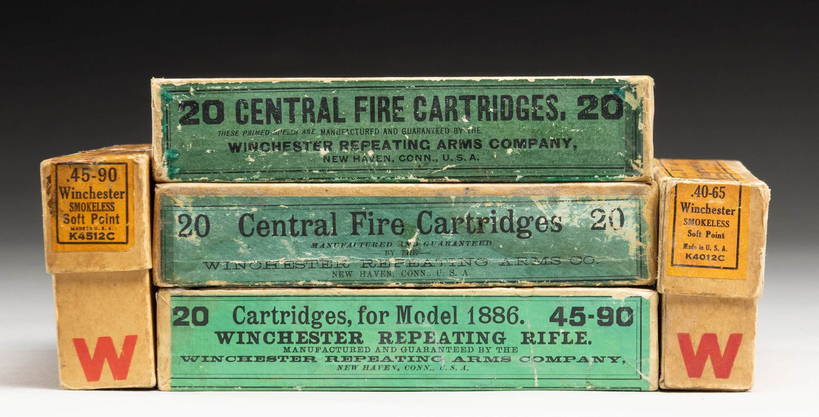 ANTIQUE BOXES OF BIG BORE WINCHESTER AMMO. (1 of 2)