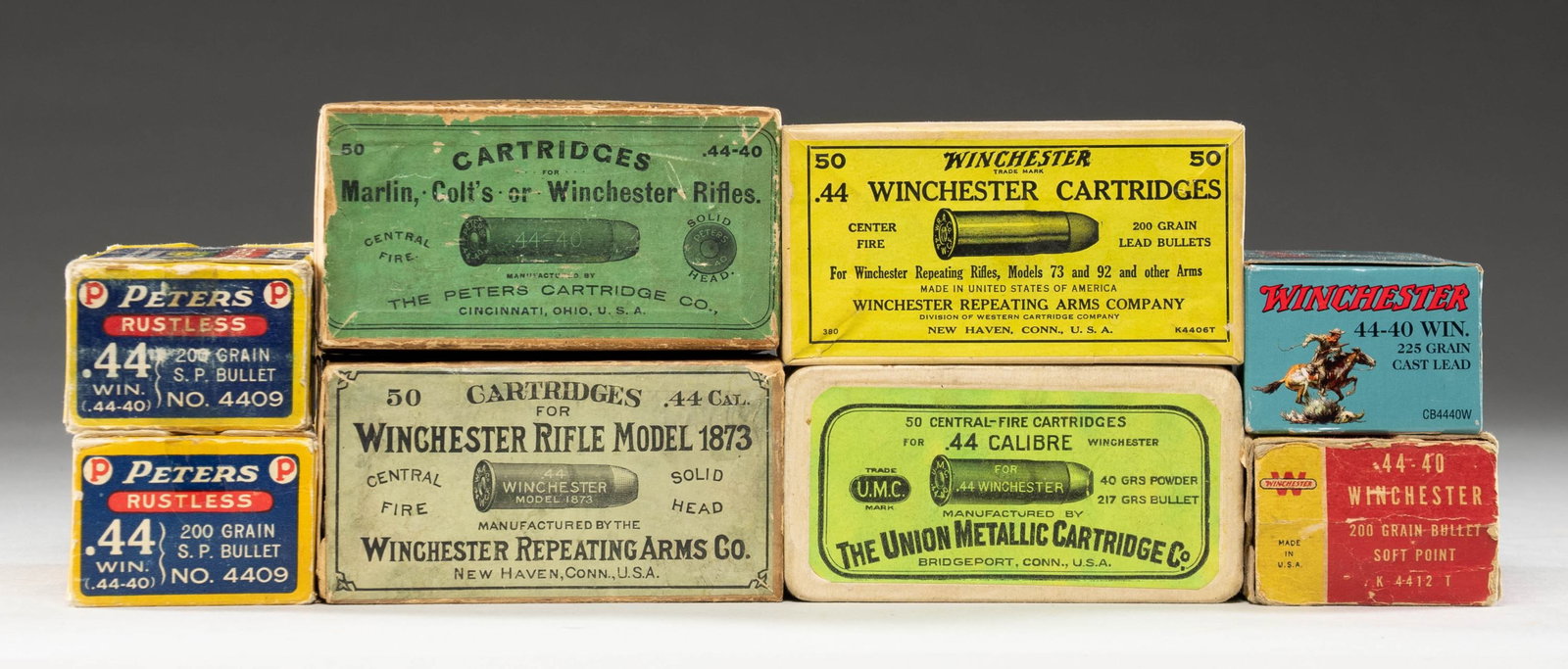 8 VINTAGE BOXES OF 44 WINCHESTER (44-40) AMMO.: All in 50 round boxes having 200 grain bullets; particulars listed for each. 1). Winchester like new blue box of Cowboy Action Loads with lead bullets. 2). REM-UMC head-stamped jacketed soft nosed amm