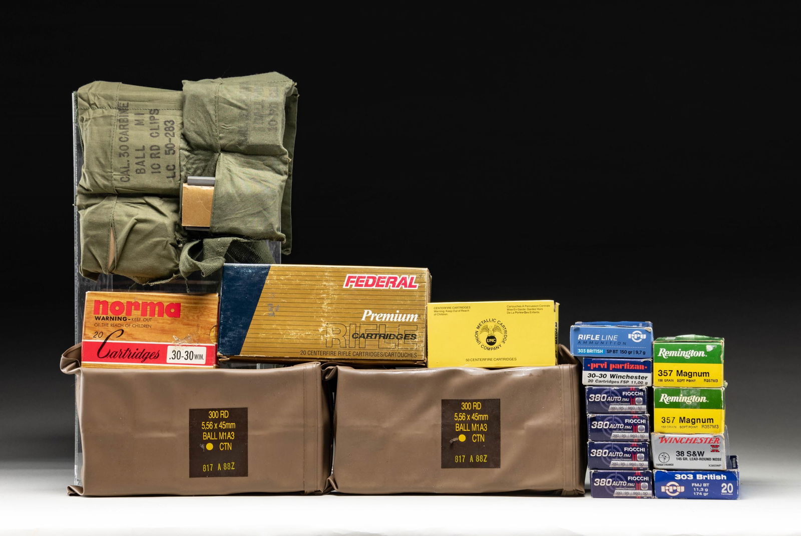 ASSORTED GROUPING OF AMMO.: This lot consists of the following ammo: 1) 199 rds. of Fiocchi 95 gr. Range Dynamics FMJ 380 ACP. Ammo is housed in 50 rd. boxes. 2) 600 rds. of South African 5.56 M1A3 FMJ ammo. Housed in two 300 rd