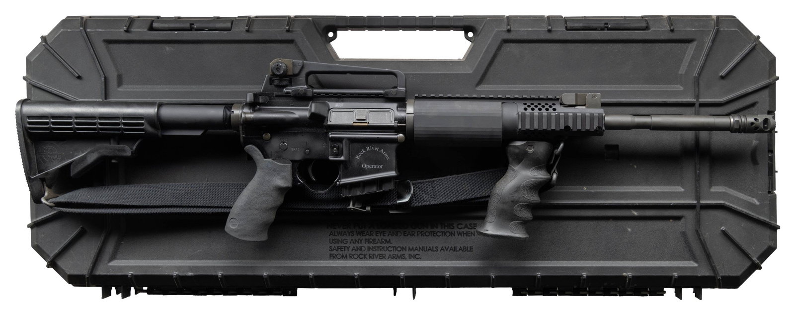 ROCK RIVER ARMS OPERATOR LAR-15 CARBINE IN CASE.: Cal. 5.56 MM. S# CM223677. Bbl. 17.5 over brake. 1:9 M4 profile barrel marked "CM" terminated w/ blind pinned RRA Tactical Muzzle Brake. Protected post, flip up front sight / low profile gas block. 9.