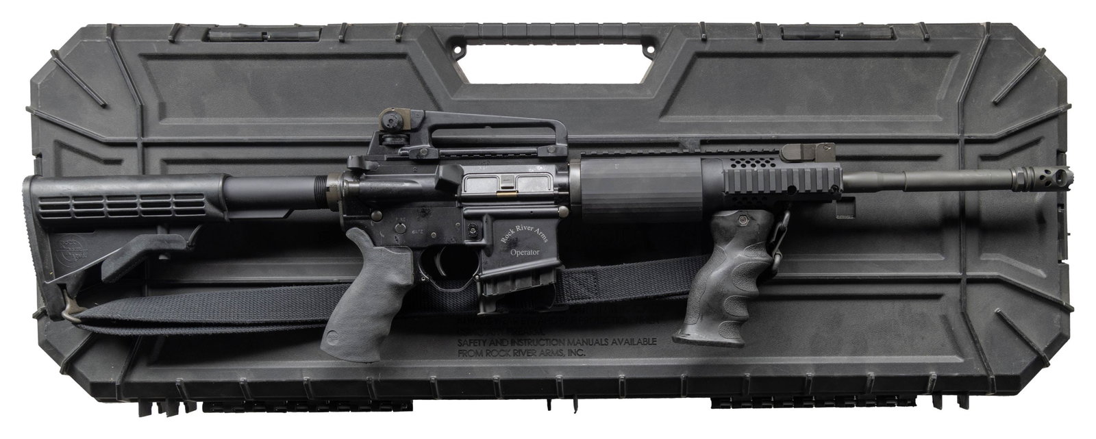 ROCK RIVER ARMS OPERATOR LAR-15 CARBINE IN CASE.: Cal. 5.56 MM. S# CM223752. Bbl. 17.5 over brake. 1:9 M4 profile barrel marked "CM" terminated w/ blind pinned RRA Tactical Muzzle Brake. Protected post, flip up front sight / low profile gas block. 9.