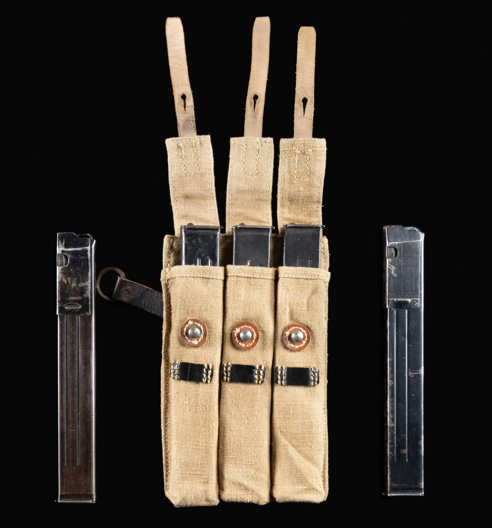 LOT OF 5 GERMAN WORLD WAR II MP40 MAGAZINES WITH: ORIGINAL POUCH. Lot of 5 MP40 submachine gun 32-rd. mags. with pouch, including: 1) x1 mag. with "bte" mfg. code, Eagle/WaAB37 proofing (Frankische Eisenwerke AG), and "41" date code. 2) x1 mag. with 