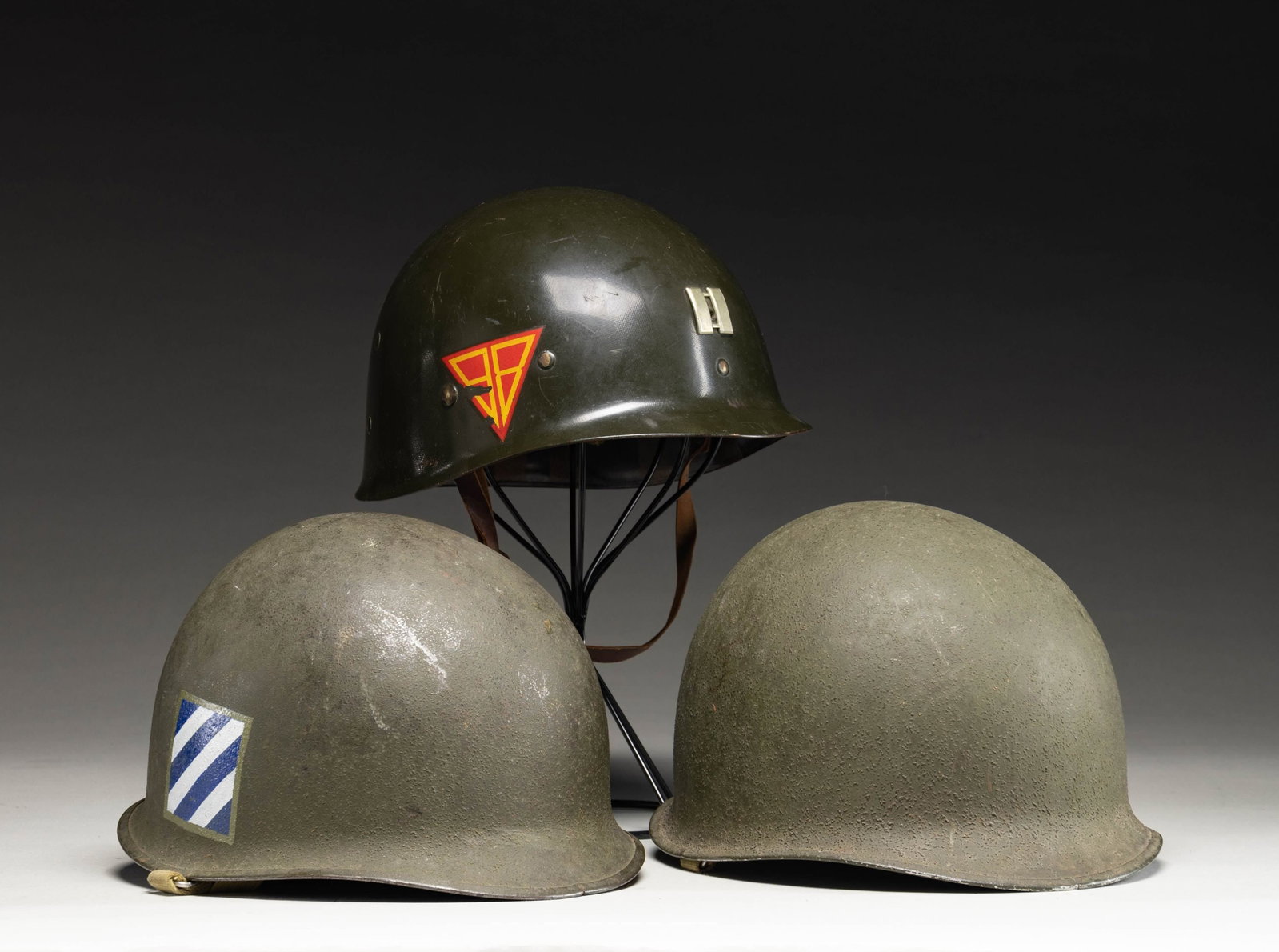 2 M1 US HELMETS WITH LINERS.: 1) NICE LATE WWII ISSUE M1 HELMET WITH 3rd INFANTRY DIVISION UNIT MARKING AND WESTINGHOUSE LINER. This high condition example was likely marked with the 3rd Infantry Insignia post WWII, however the M1