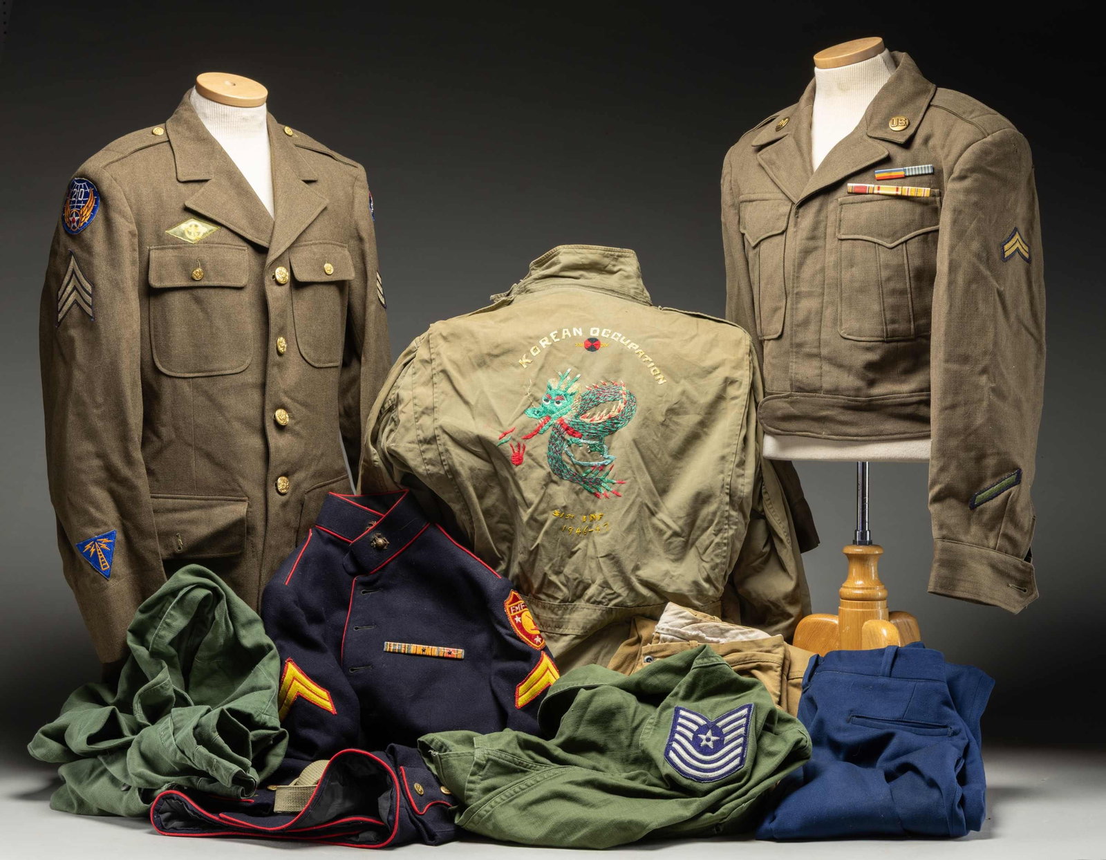 LOT OF U.S. UNIFORMS.: 1) WWII U.S. Army field jacket with Oriental theme embroidery featuring a commemoration of the Korean Occupation of the 7th Div. 31st Infantry from 1946-47 with the name Tami.2) WWII U.S.M.C. dress