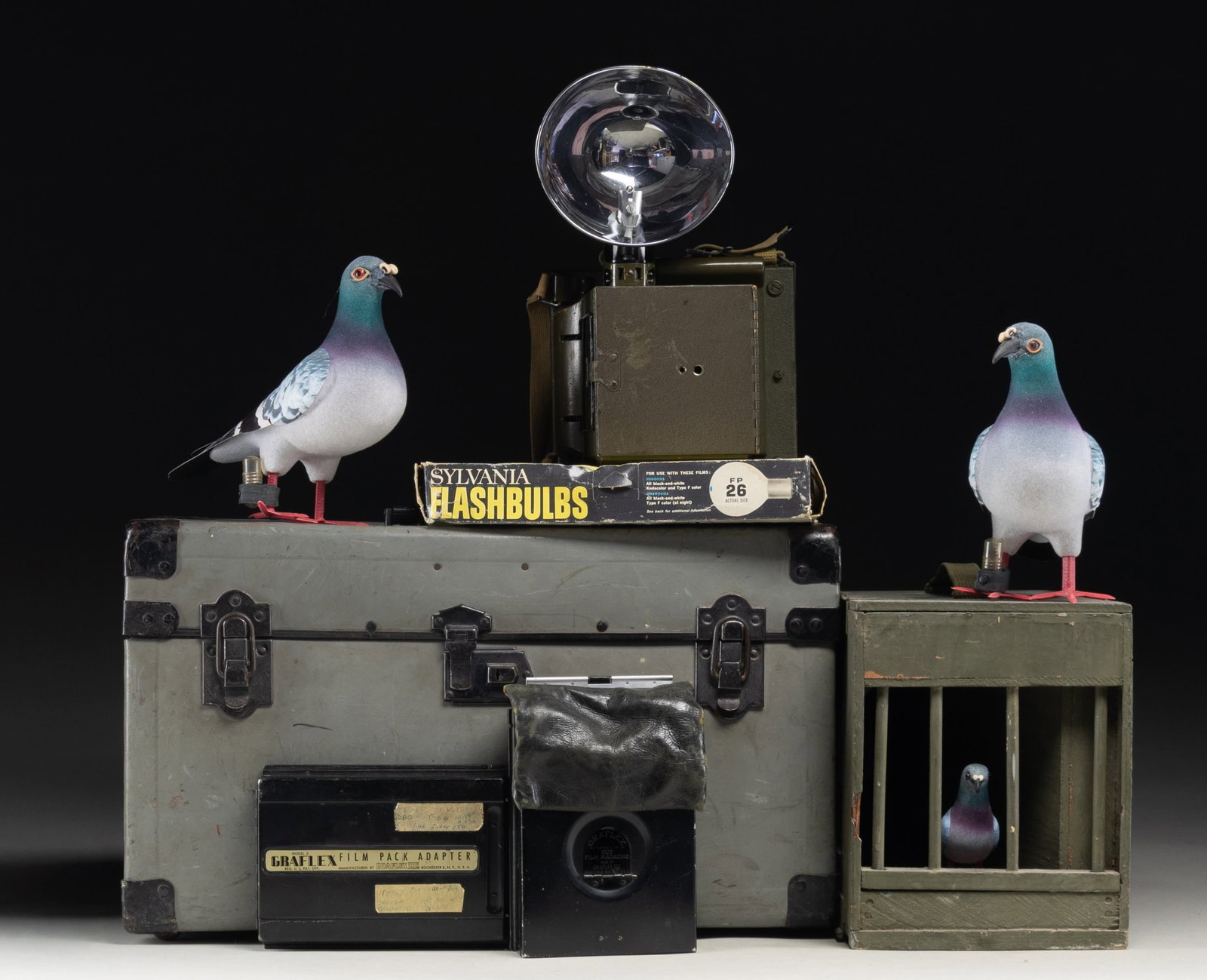 LOT OF TWO U.S. WWII NAVY COMBAT CAMERA & PIGEON: CARRIER BOX. 1) U.S. WWII Navy Combat Camera mfg. by the Folmer Graflex Corp. Underside of camera features a data plate that reads "PROPERTY U.S. NAVY/ CAMERA, COMBAT/ 18-C-235/ CONTRACT NO. SERIAL