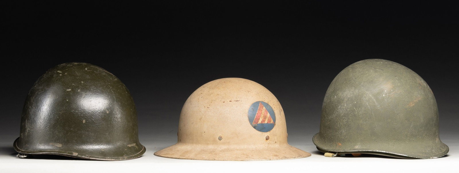 TWO U.S. WWII M1 HELMETS AND ONE CIVIL DEFENSE AIR (1 of 4)