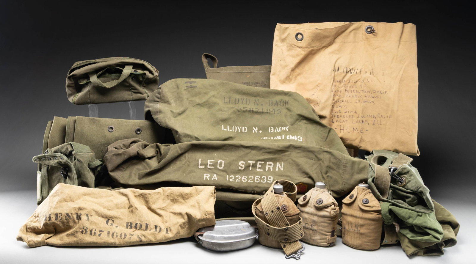 MIXED LOT OF USGI GEAR.: This lot consists of the following items: 1) Three USGI canteens with WW2 covers. One canteen is undated, & other two marked "ACA 1918". Two tan US marked belts also present. 2) 1945 dated M1 Ammuniti