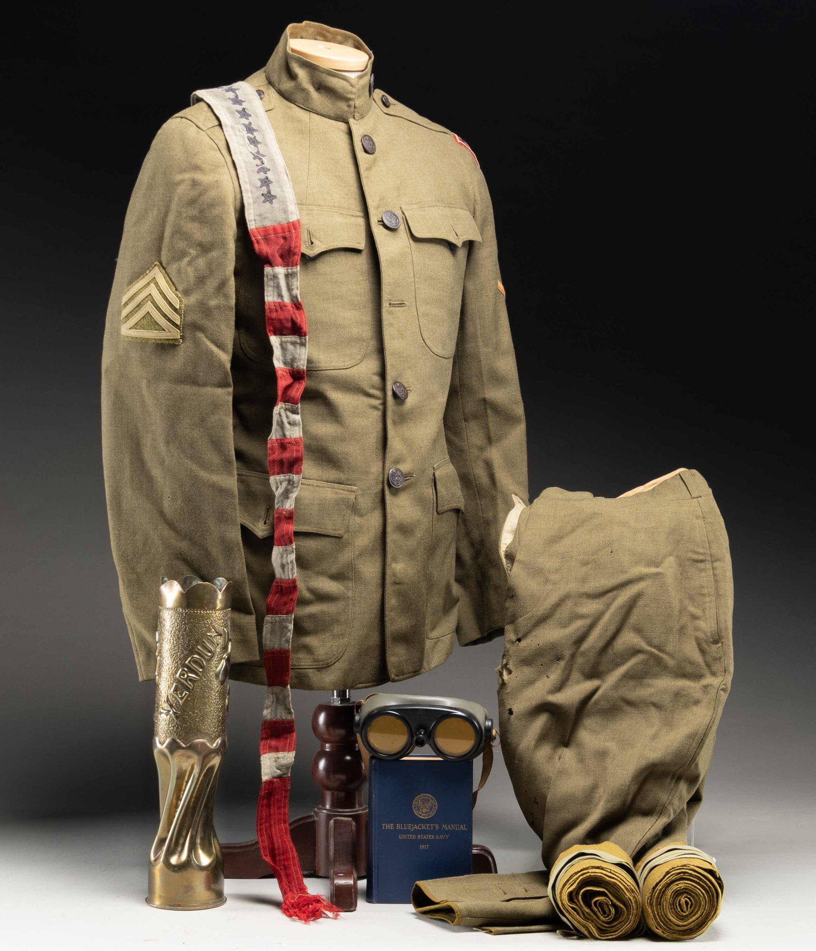 82ND DIVISION WWI UNIFORM & MORE.: This lot contains 1 WWI US uniform with 82nd infantry division patch that was authorized in 1918 and a collar disk showing a "US" over "325", 1 Pair of puttees, 1 tinted goggles manufactured by