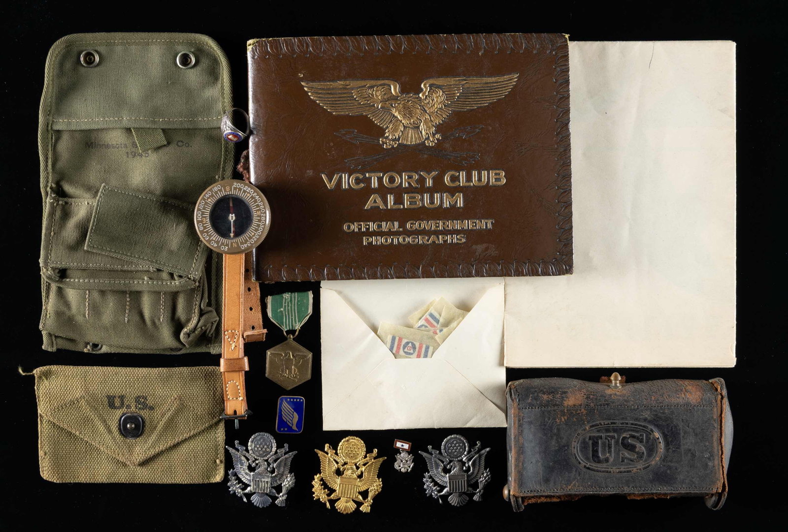 ASSORTED MILITARIA LOT.: This lot consists of the following items: 1) WW2 Victory Club Photo Album. Album features varied WW2 US photos. 2) 1942 dated official US Government Civil Defense Insignia Poster. 3) US McKeever