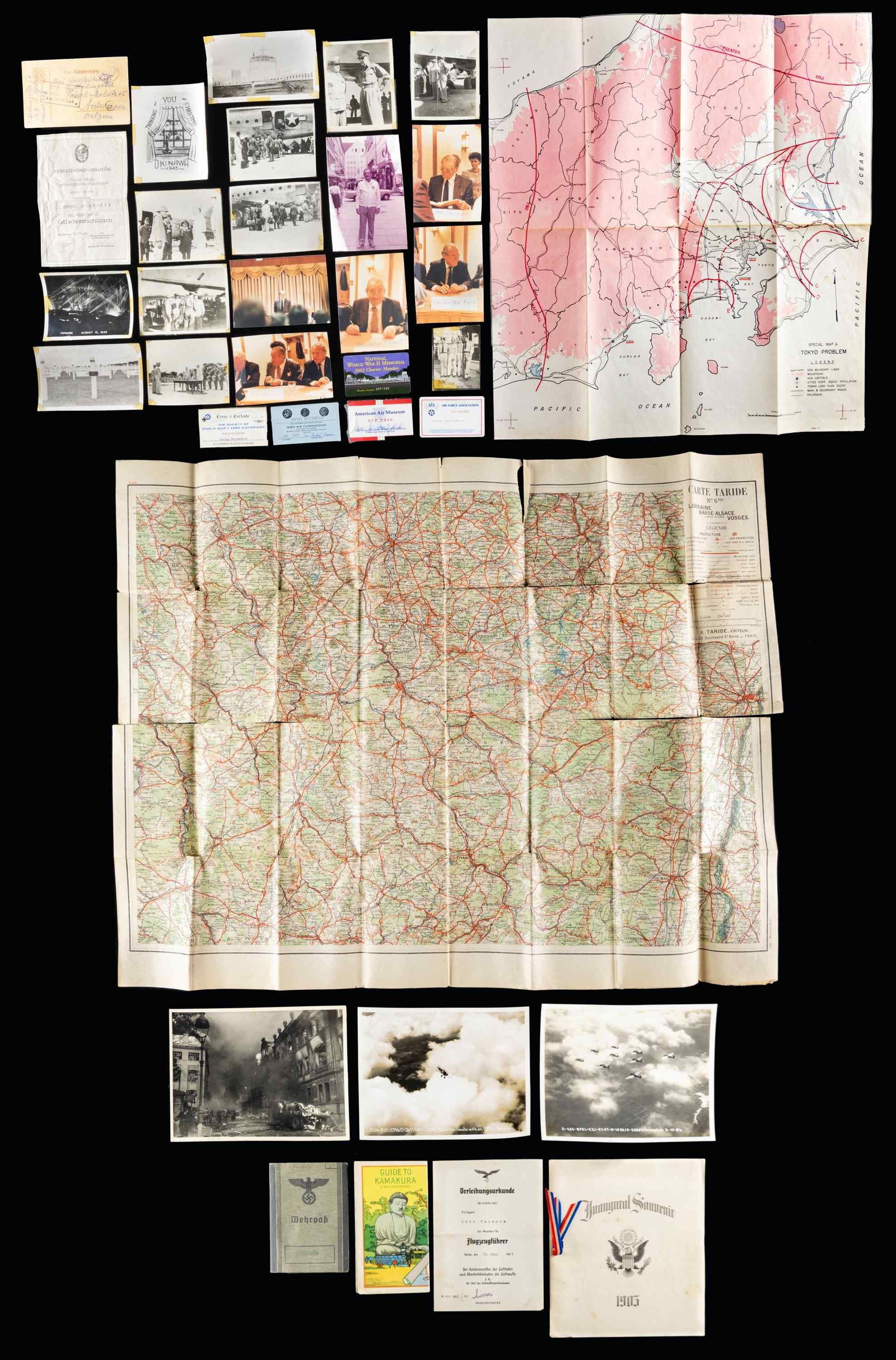 MILITARY RELATED PHOTOGRAPH AND EPHEMERA GROUP.: This varied lot contains 3 large format photos of planes and bombed cities, 1 Guide to Kamakura, 1 Inaugural souvenir book dated 1905 for Theodore Roosevelt, 1 Large French map of the Lorraine, Basse-