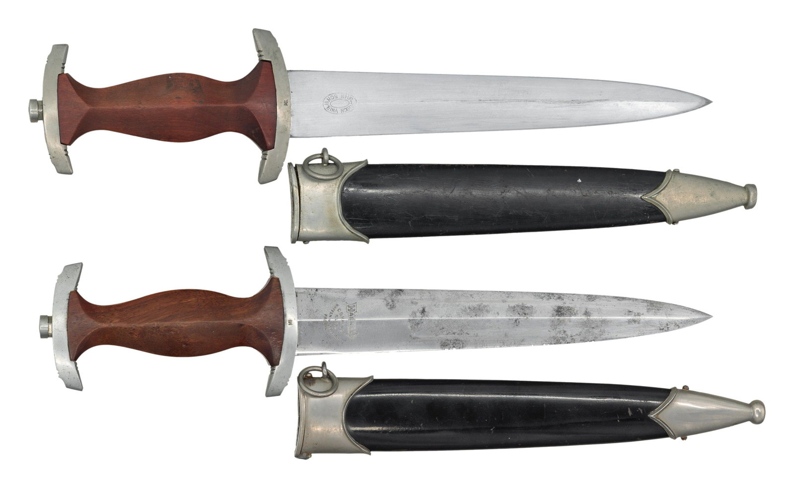 2 WWII GERMAN NSKK DRESS DAGGERS.: 1) HAENEL. Nickel silver upper and lower crossguards with MI Gruppe marking. Nickel silver eagle and enamel SA emblem. Black enamel coated scabbard with nickel silver mounts. CONDITION: overall fair-g