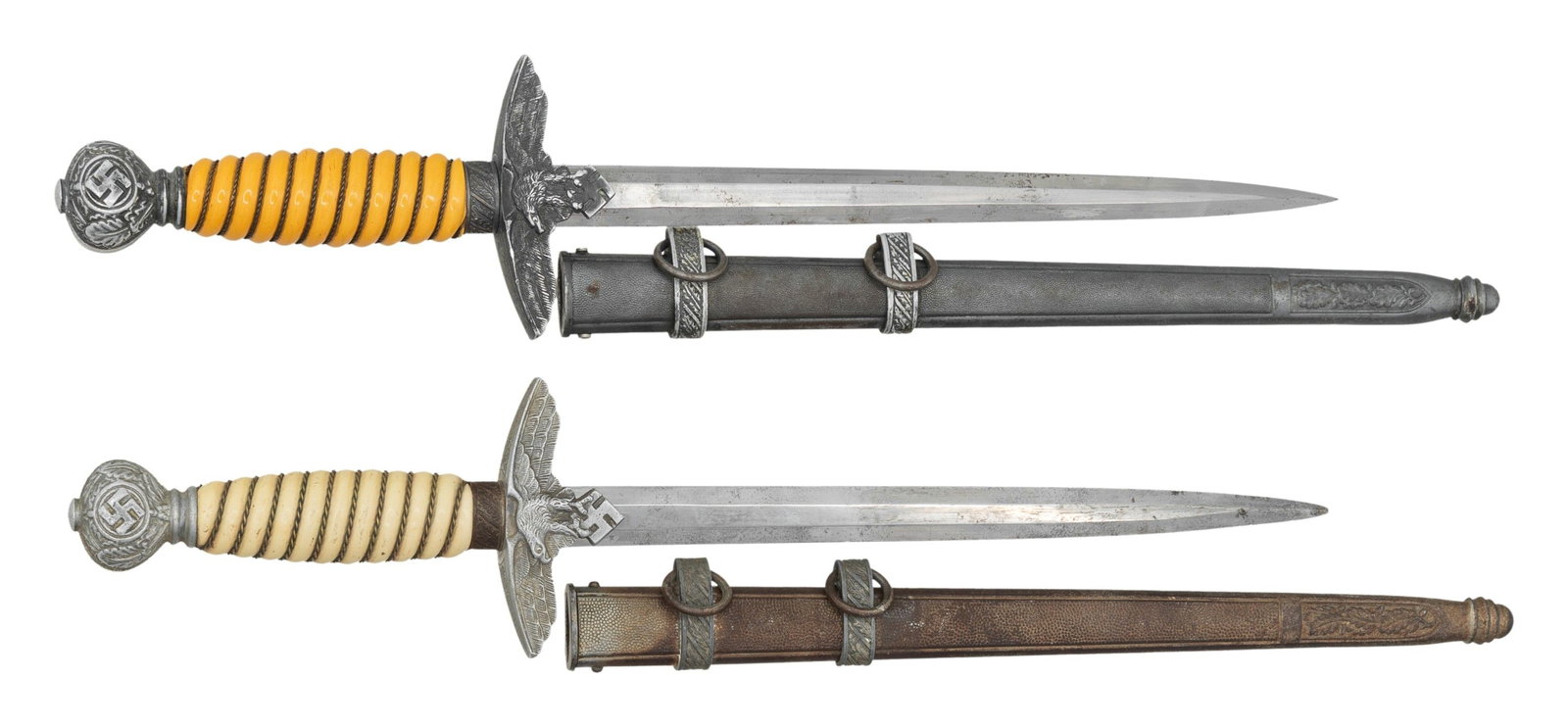 2 WWII GERMAN 2nd MODEL LUFTWAFFE DAGGERS.: 1) E.F. HORSTER. Despite Horster producing their Army dagger fittings in-house, Horster purchased Luftwaffe fittings from other makers and casters. This example has a crossguard that has incised oak
