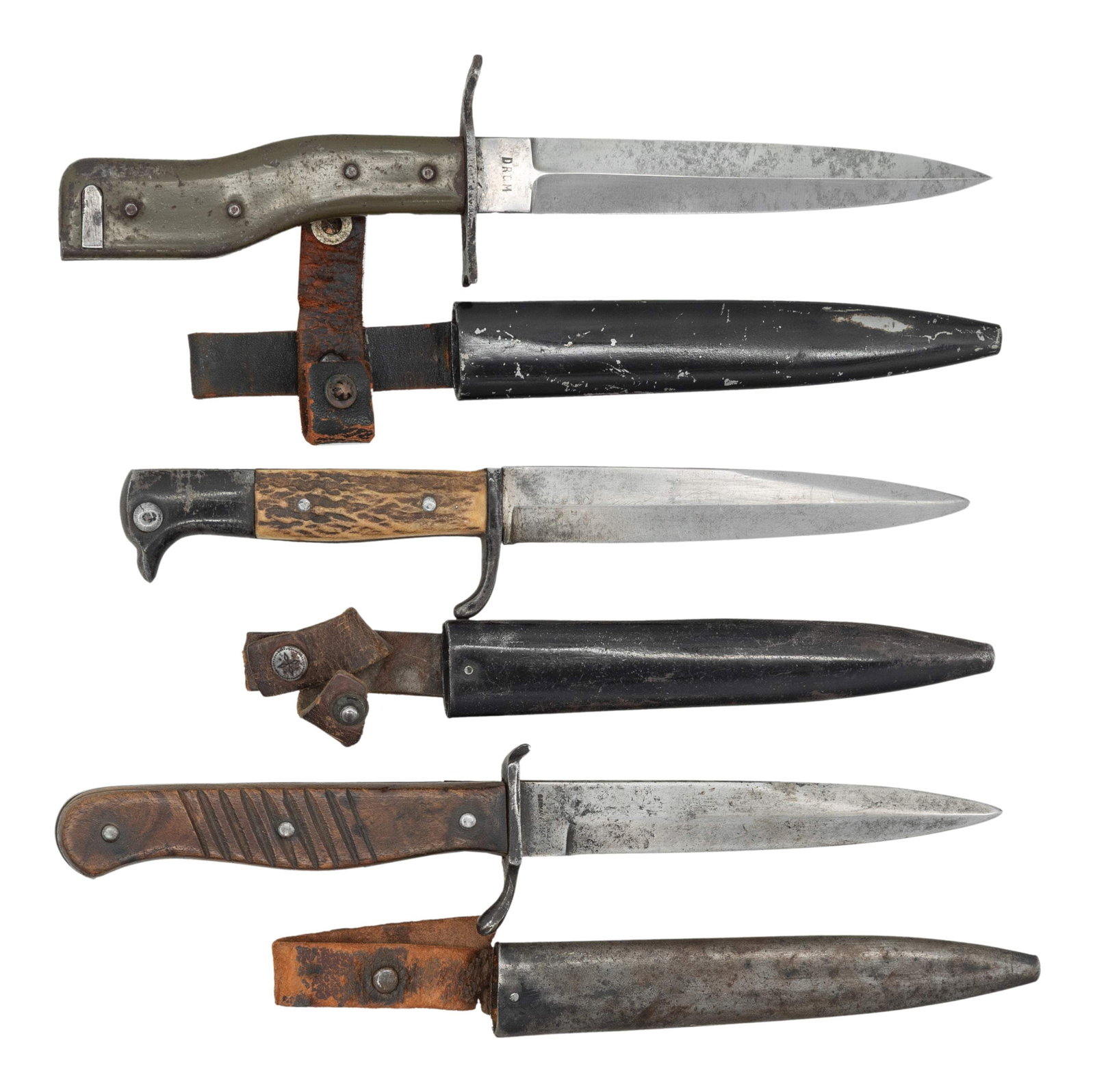 3 WWI & WWII GERMAN BAYONETS OR FIGHTING KNIVES.: 1) M1915 Ersatz model bayonet and trench knife often called the "crank handle" knife because of its handle. It was produced by Deutche Machinen Fabrik AG in Duisburg for the GEW 98. The blade is