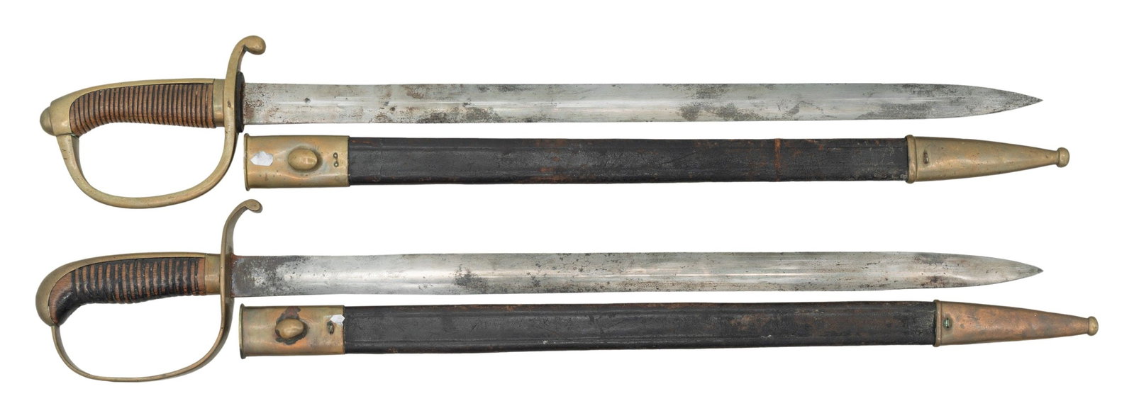 2 IMPERIAL GERMAN POLICE SHORT SWORDS WITH: SCABBARDS. Both appear to be Bavarian with 21.25" blades; 26.5" overall. Both made by WKC; 1 blade has etched name that is partially discernable. Brass hilt with grooved wood grip. Leather scabbards