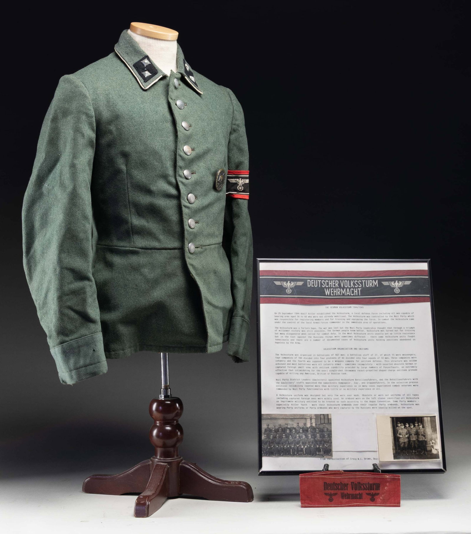 DEUTSCHER VOLKSSTURM WEHRMACHT GROUP.: this interesting group features an 8 button green wool uniform with white piping on the collar with black collar tabs each having 2 pips. The left sleeve has a red, white, and black printed Deutscher 