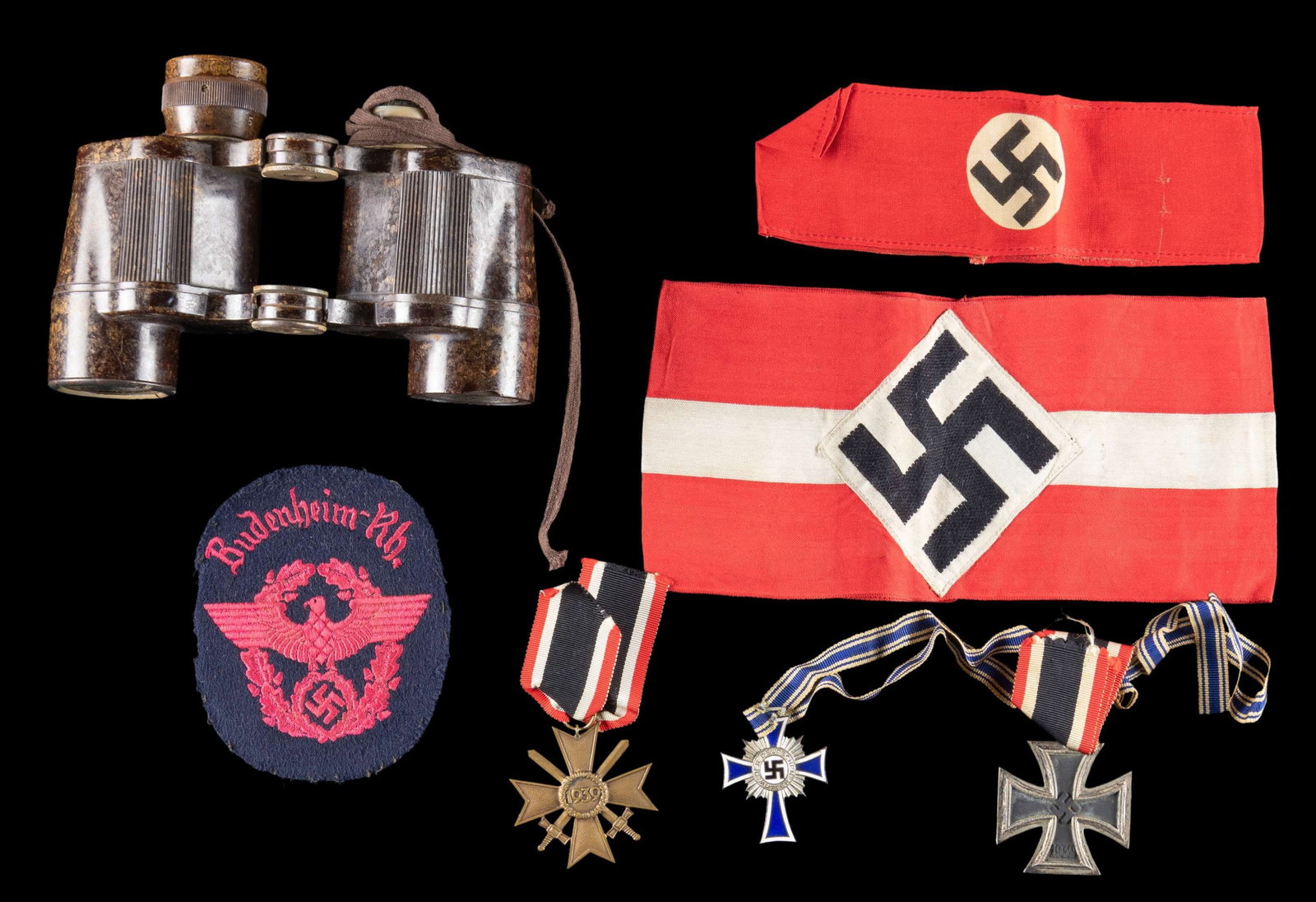 WWII GERMAN BINOCULARS MEDALS, CLOTH, & MORE.: This fine WWII German lot contains 1 pair of bakelite binoculars with one eye piece cover missing, 1 HJ armband, 1 Party helper armband, 1 Pink and black Police sleeve patch from Budenheim-Rh., 1 WWII