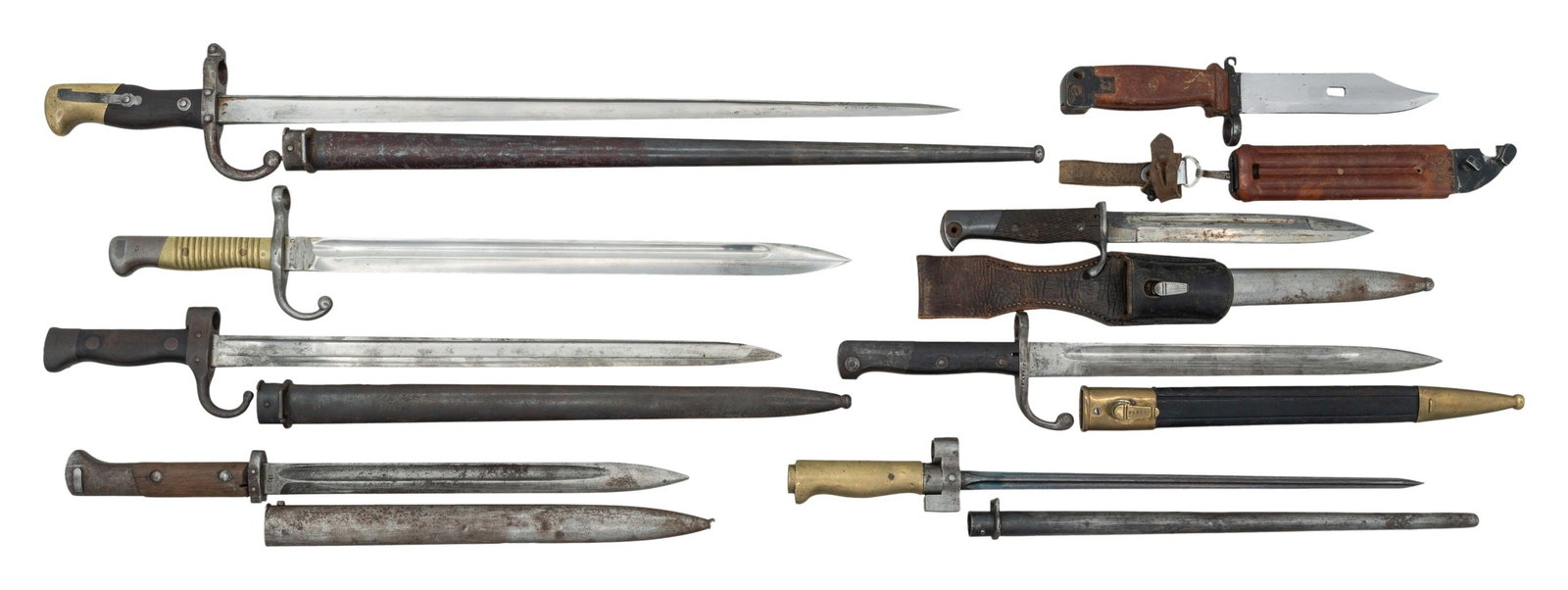 LOT OF 8 FOREIGN BAYONETS.: This lot consists of the following bayonets: 1) 86/93 Lebel Bayonet. Brass handles. Mismatch but correct scabbard present. CONDITION: brass handles are a dull yellow with dings, oxidation & age wear. 