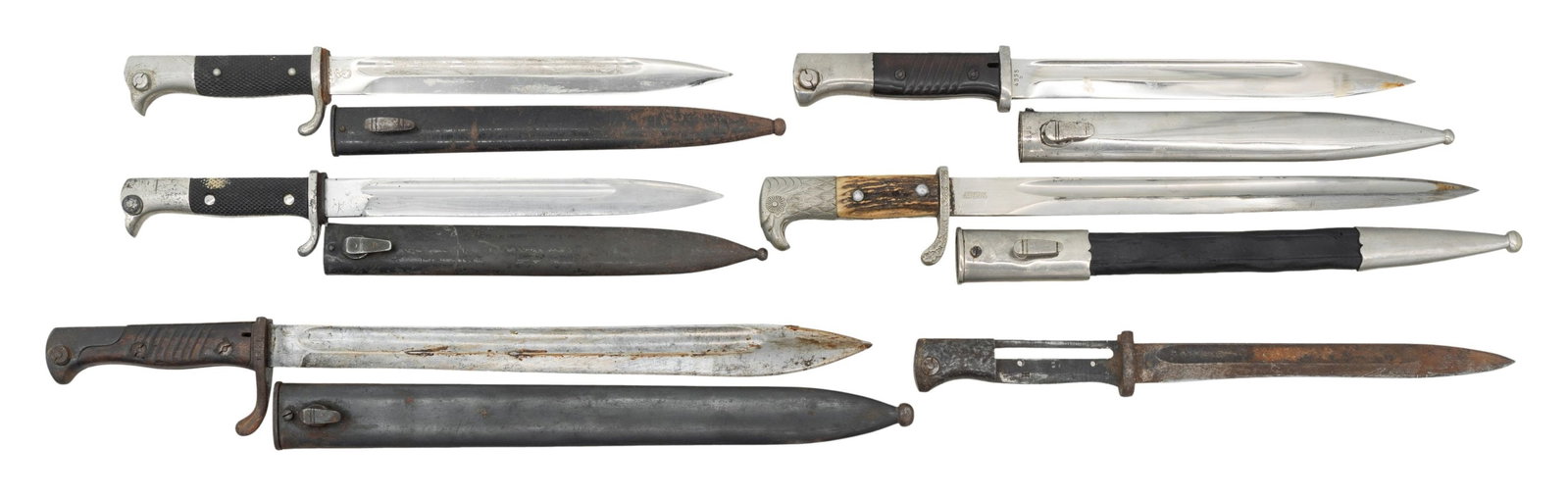LOT OF SIX BAYONETS.: This lot consists of the following bayonets: 1) German 98/05 Bayonet. Butcher blade made in 1917. Blade is still in-the-white & was made by Weyserberg & Kirschbaum. Crossguard has 1920 Weimar stamp. S