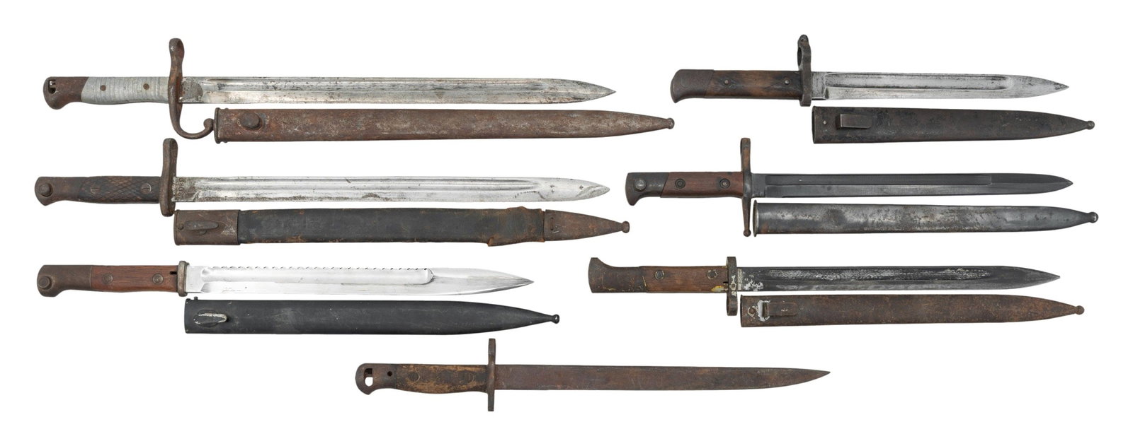 GROUPING OF 7 FOREIGN BAYONETS.: 1) GERMAN 1871/84. Includes and added steel scabbard. 2) ARGENTINE 1891. With allow grips. Steel scabbard. 3) ITALIAN 1891 CARCANO. With steel scabbard.4) INDIA PATTERN NO.1 MKII* BAYO. Mfg by RFI.