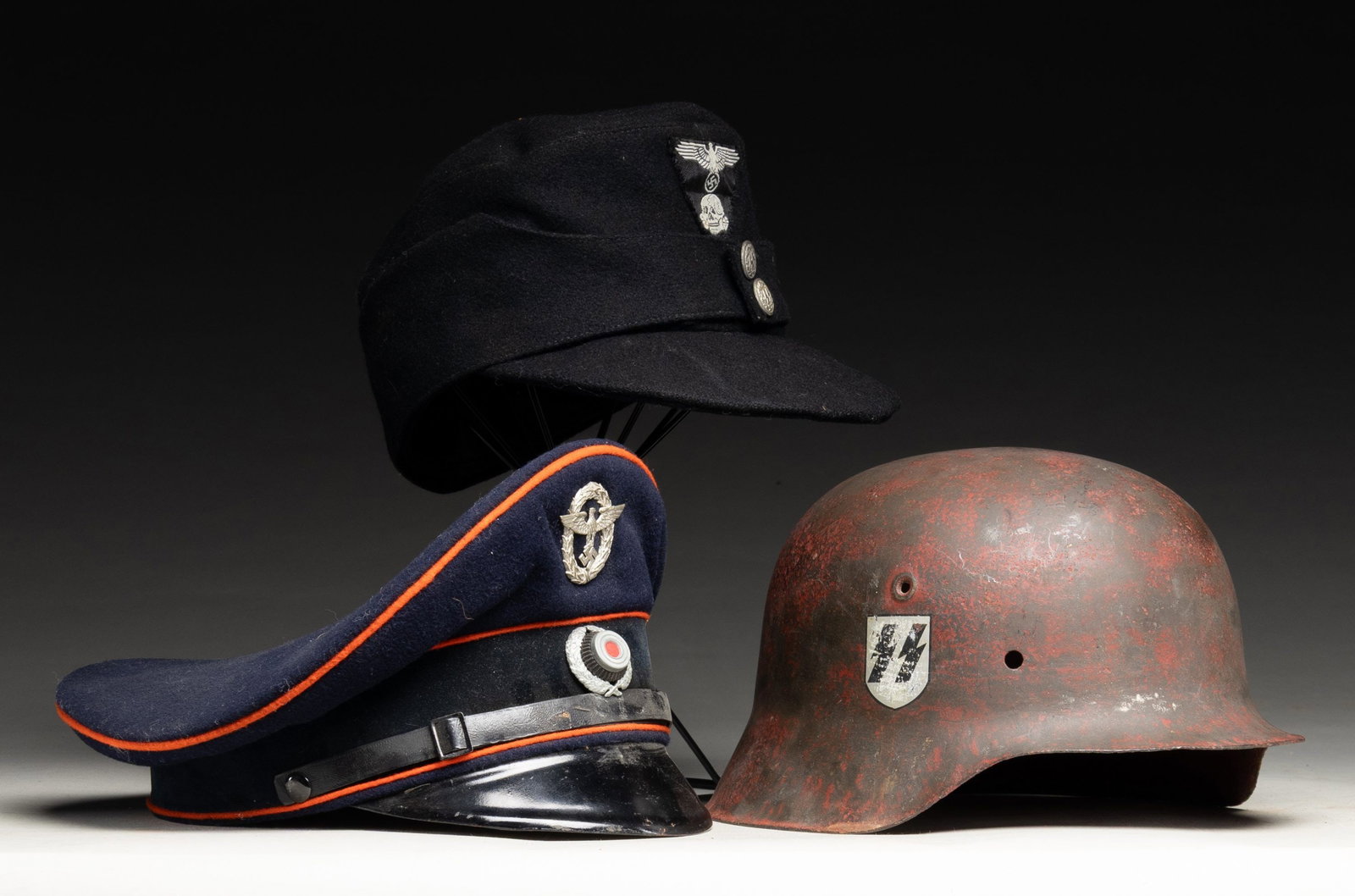 LOT OF 3 PIECES OF GERMAN WWII STYLE HEAD GEAR.: Lot of 3 pieces of German World War II head gear, including: 1) German WWII M42 stahlhelm. Helmet exhibits a gray painted finish, with areas of red pint visible overall. Right side of helmet exhibits 