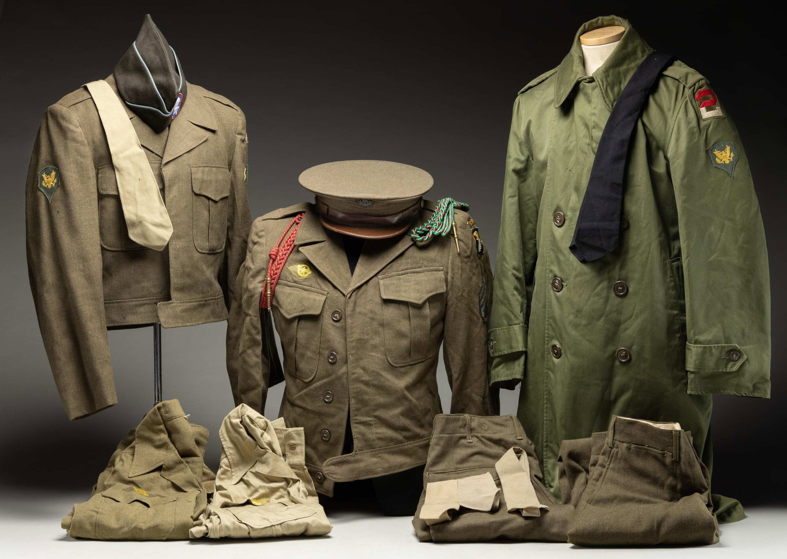 GROUPING OF U.S. WWII MILITARY UNIFORMS. (1 of 1)